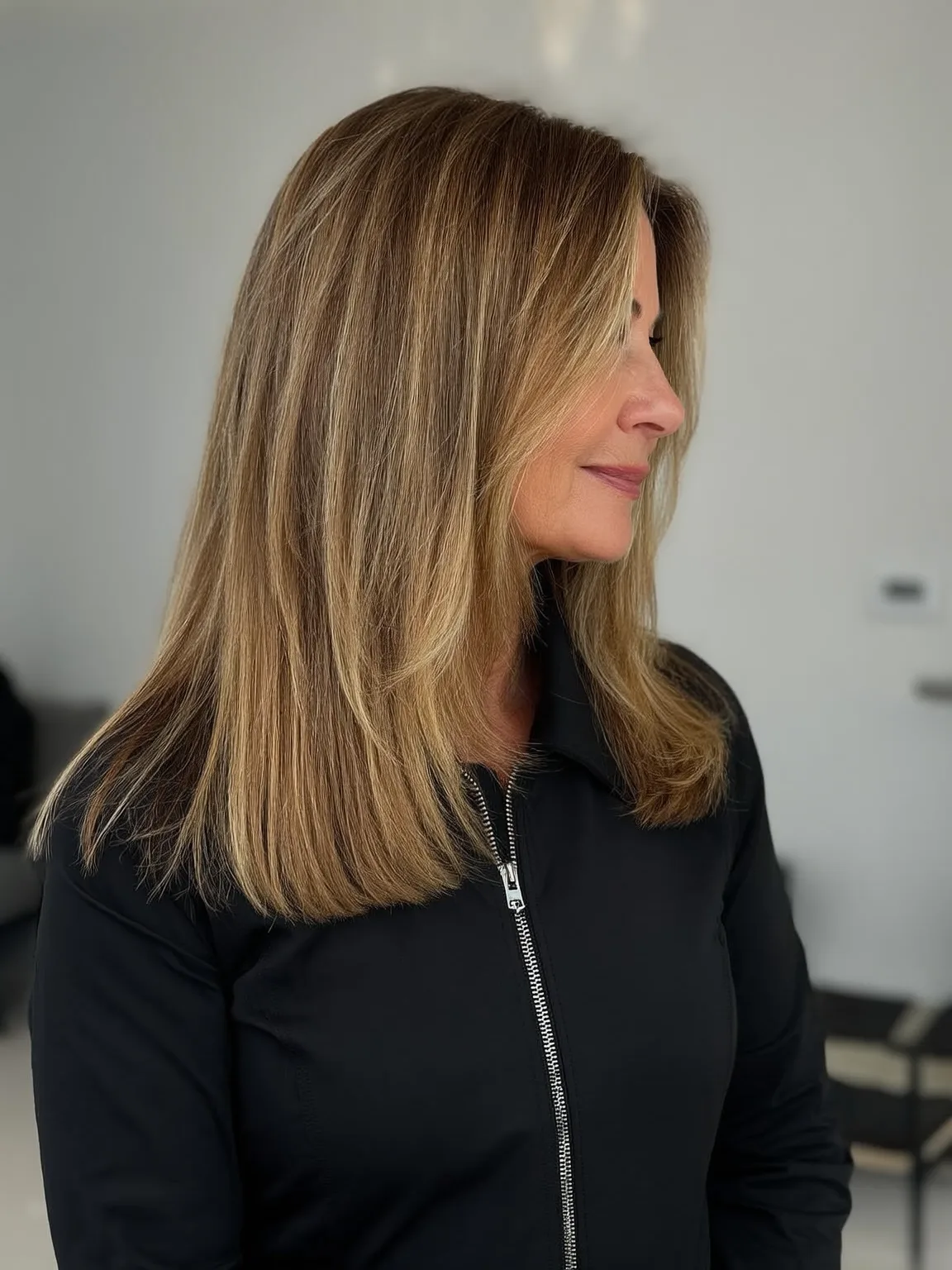 Long Honey Blonde Balayage Layers with Side Bangs