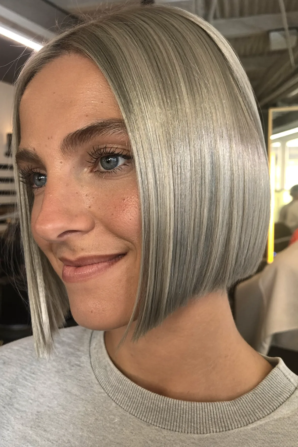 Sleek Silver Gray Chin-Length Bob With Solid Color Shine