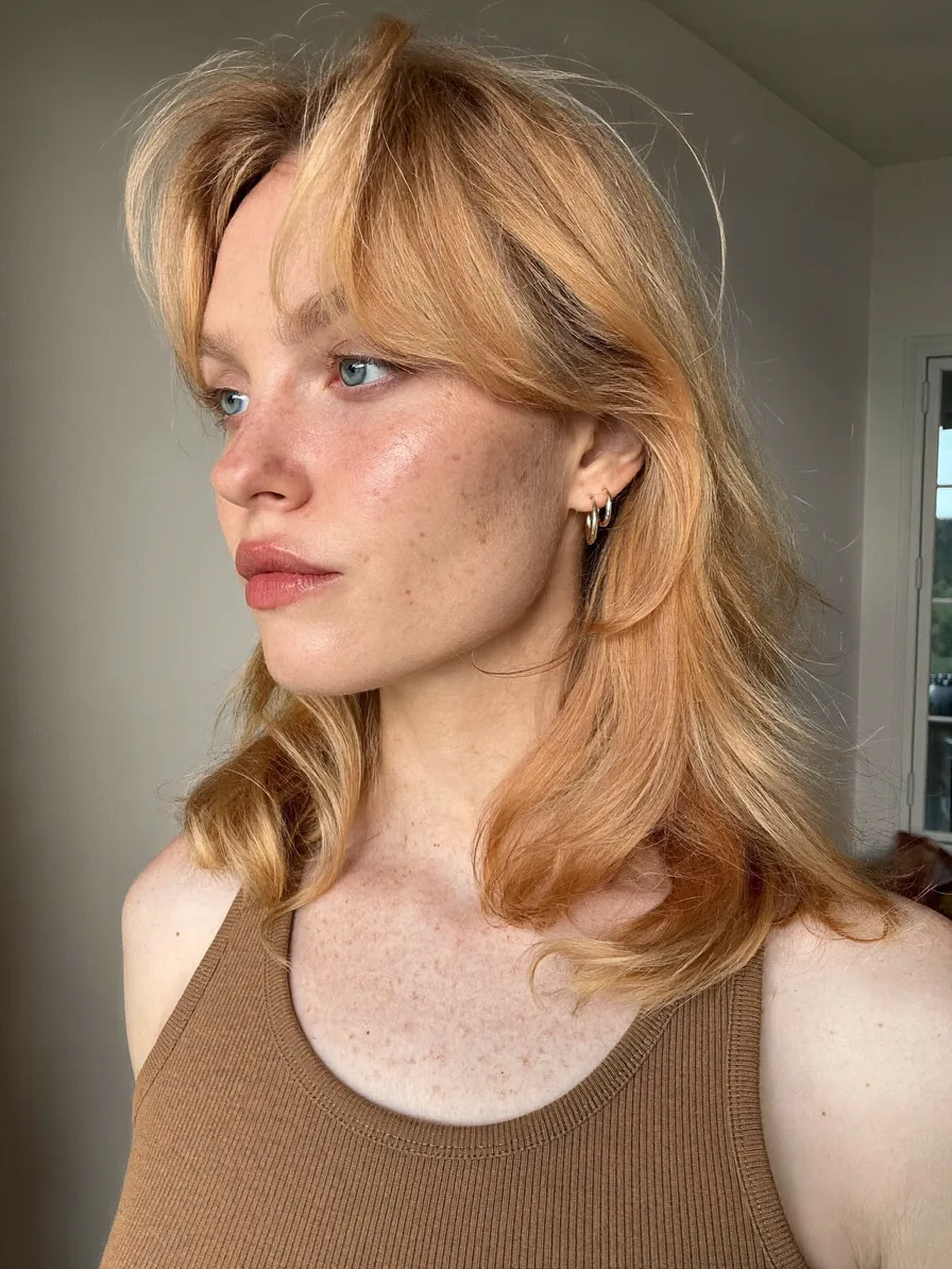 Soft Layered Shoulder-Length Hairstyle with Curtain Bangs