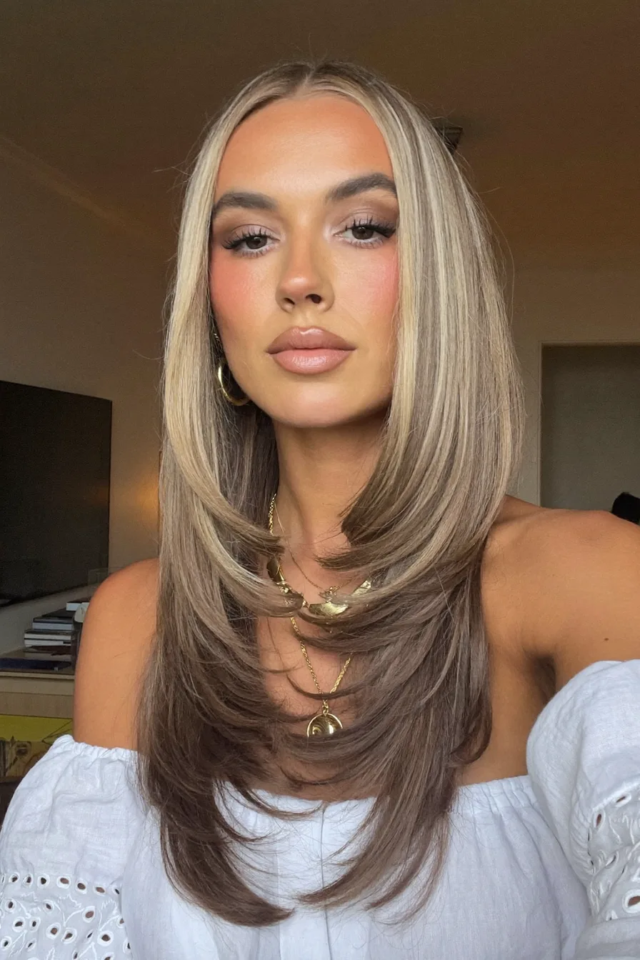 Center-Parted Sleek Straight Long Layered Hair With Soft Face-Framing