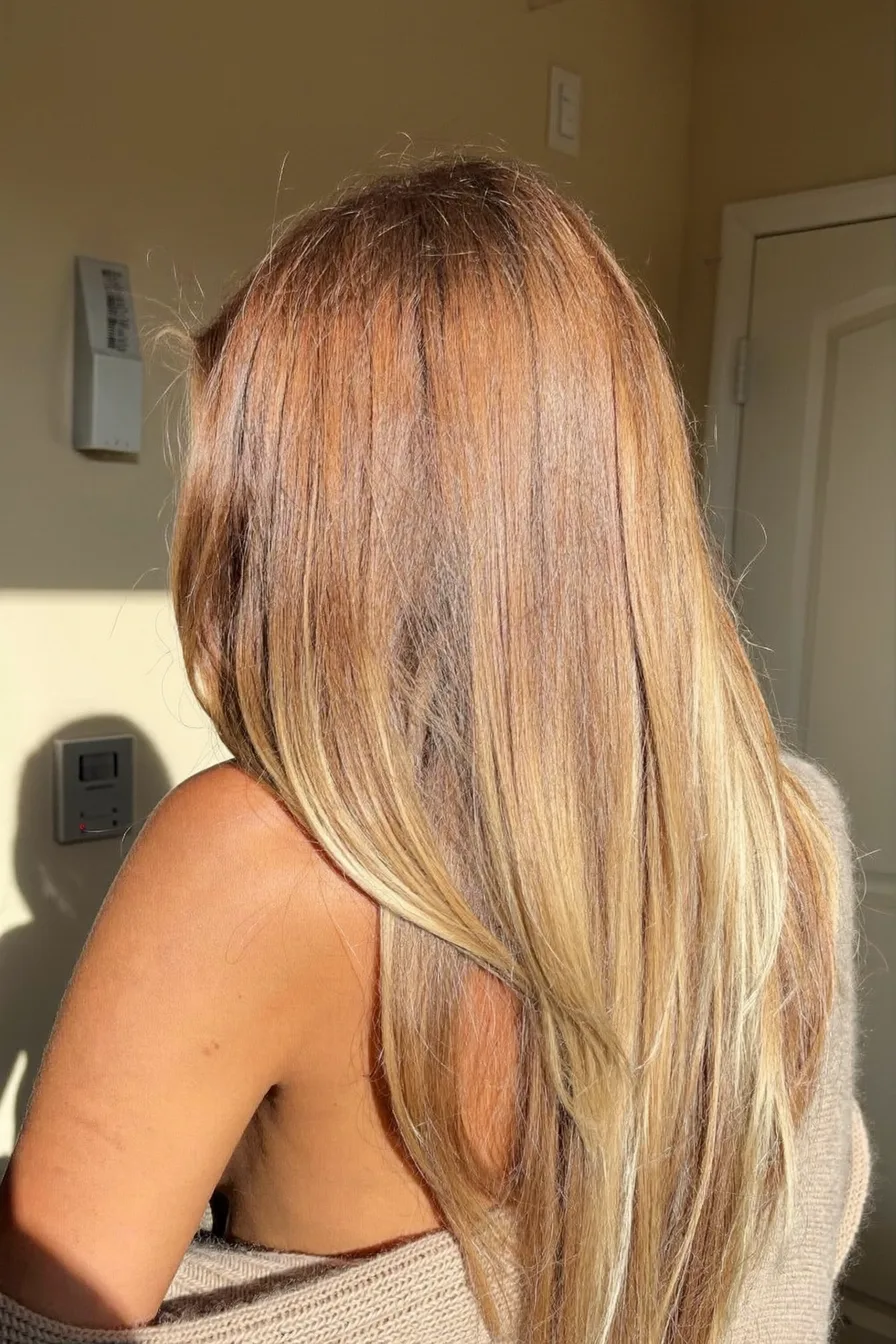 Layered Caramel Brown Shoulder-Length Cut with Sunlit Dimension