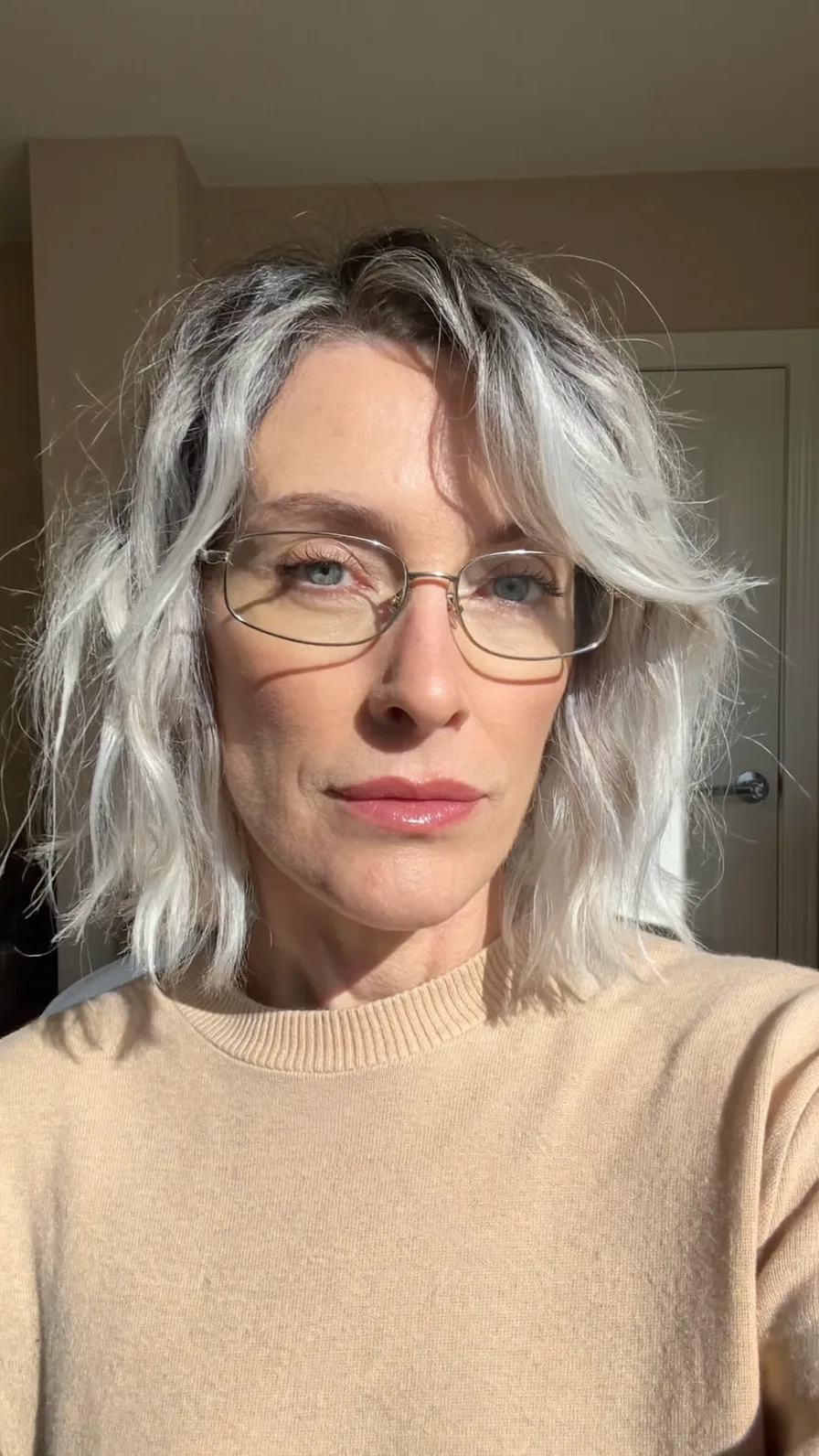 Choppy Layered Chin-Length Silver Hair with Side-Swept Bangs