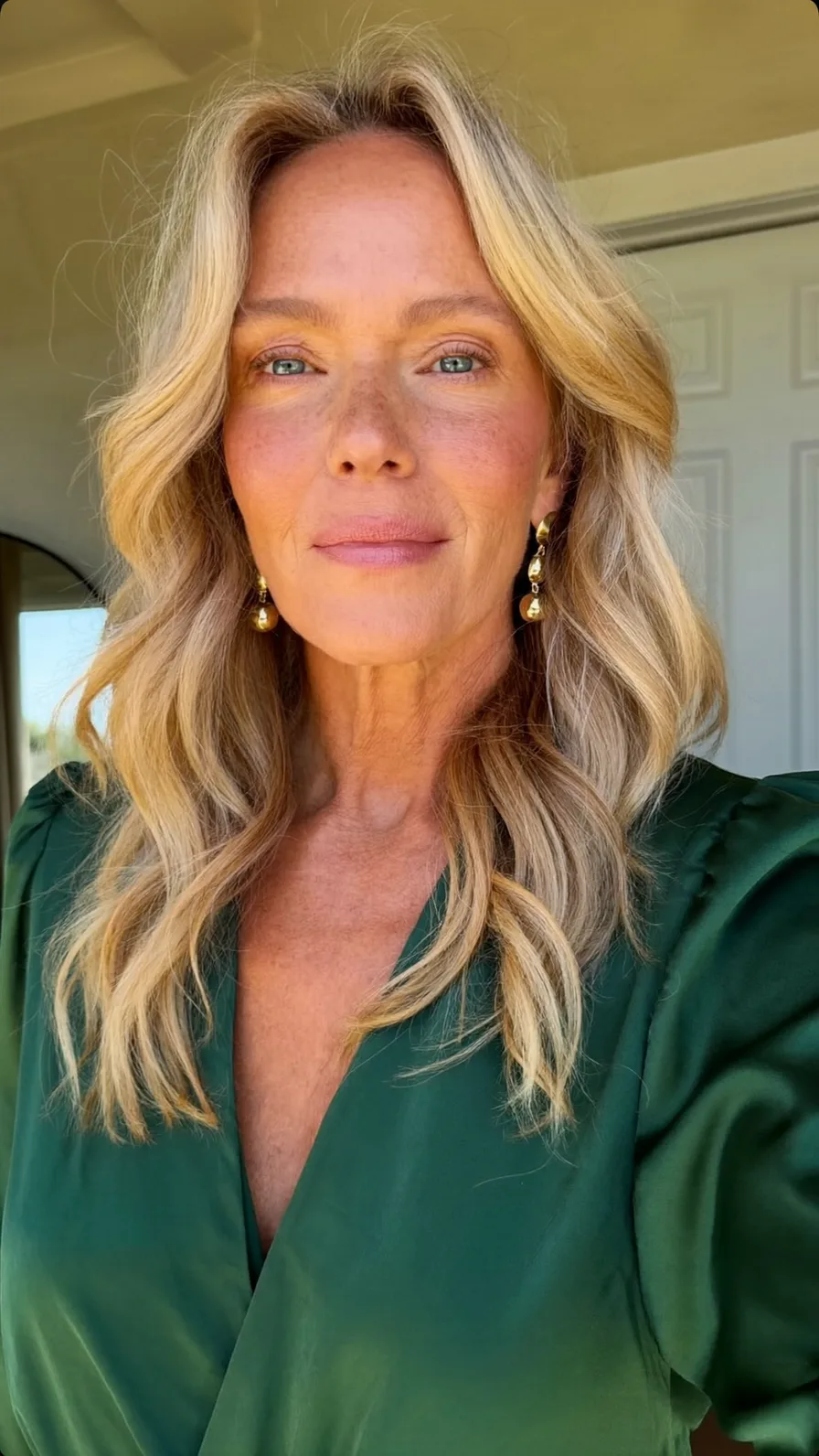 Soft Honey Blonde Shoulder-Length Waves with Curtain Bangs