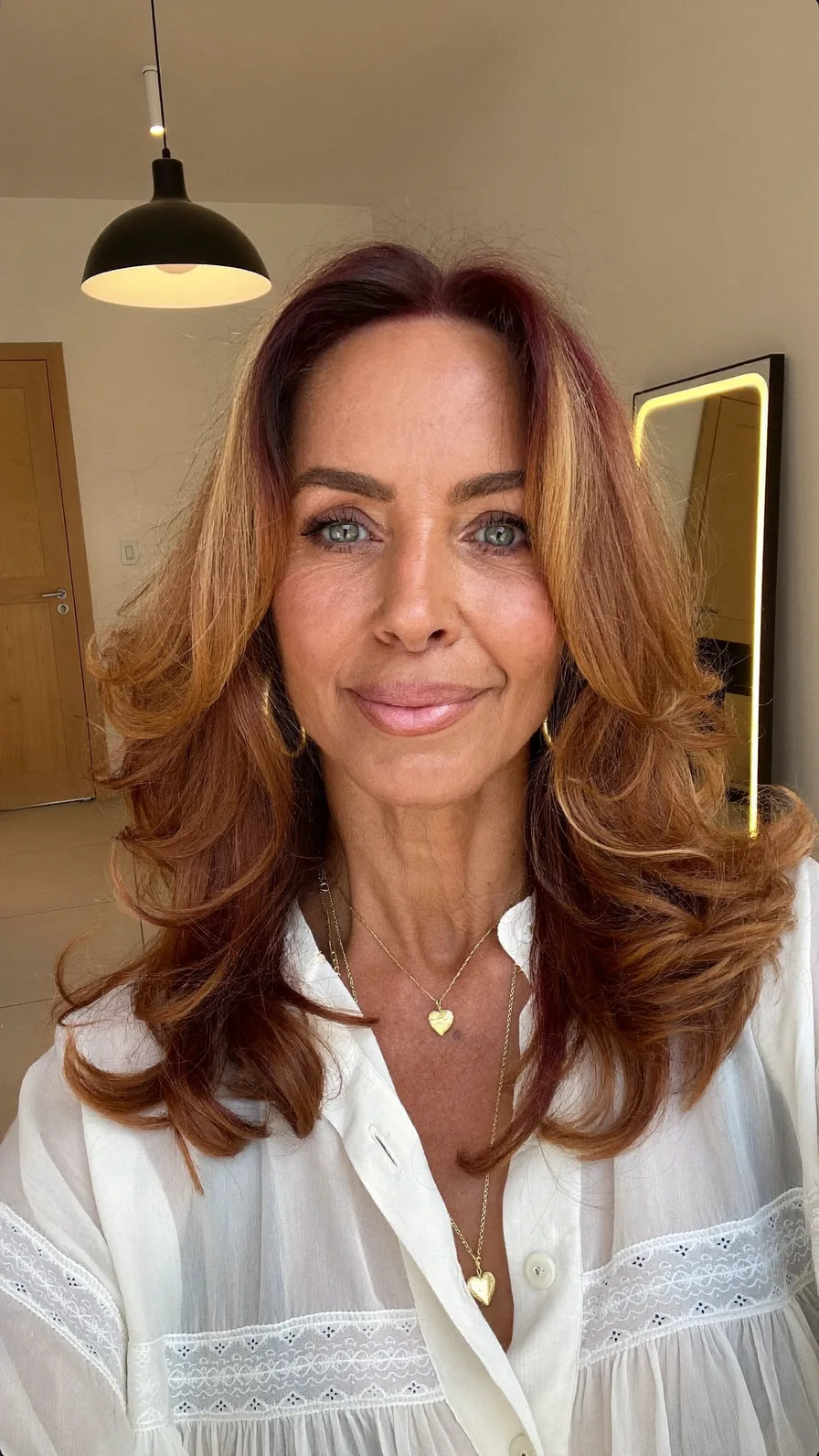Voluminous Long Layered Blowout with Honey Money Piece Highlights