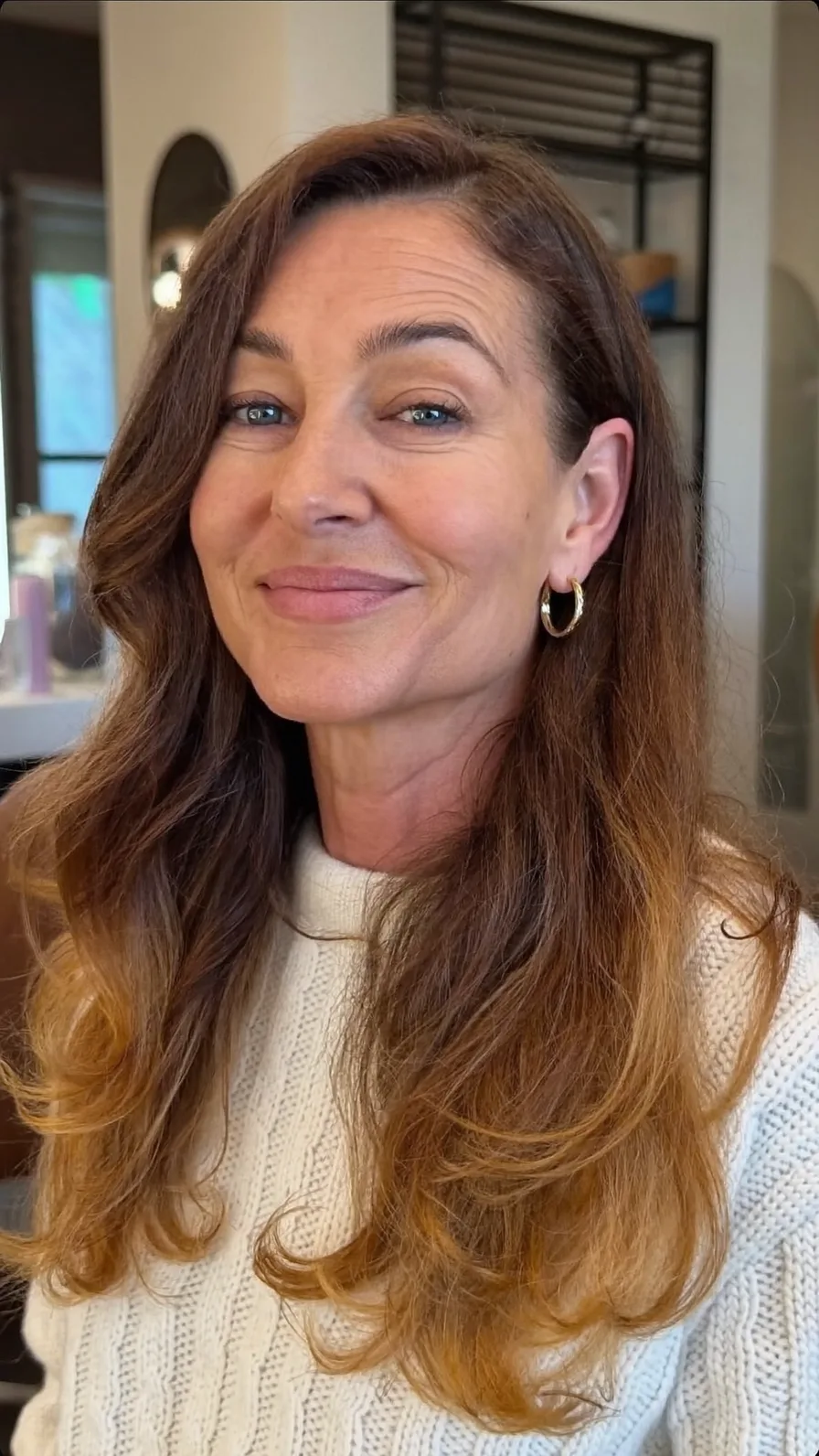 Warm Chestnut Long Layered Waves with Side-Swept Bangs