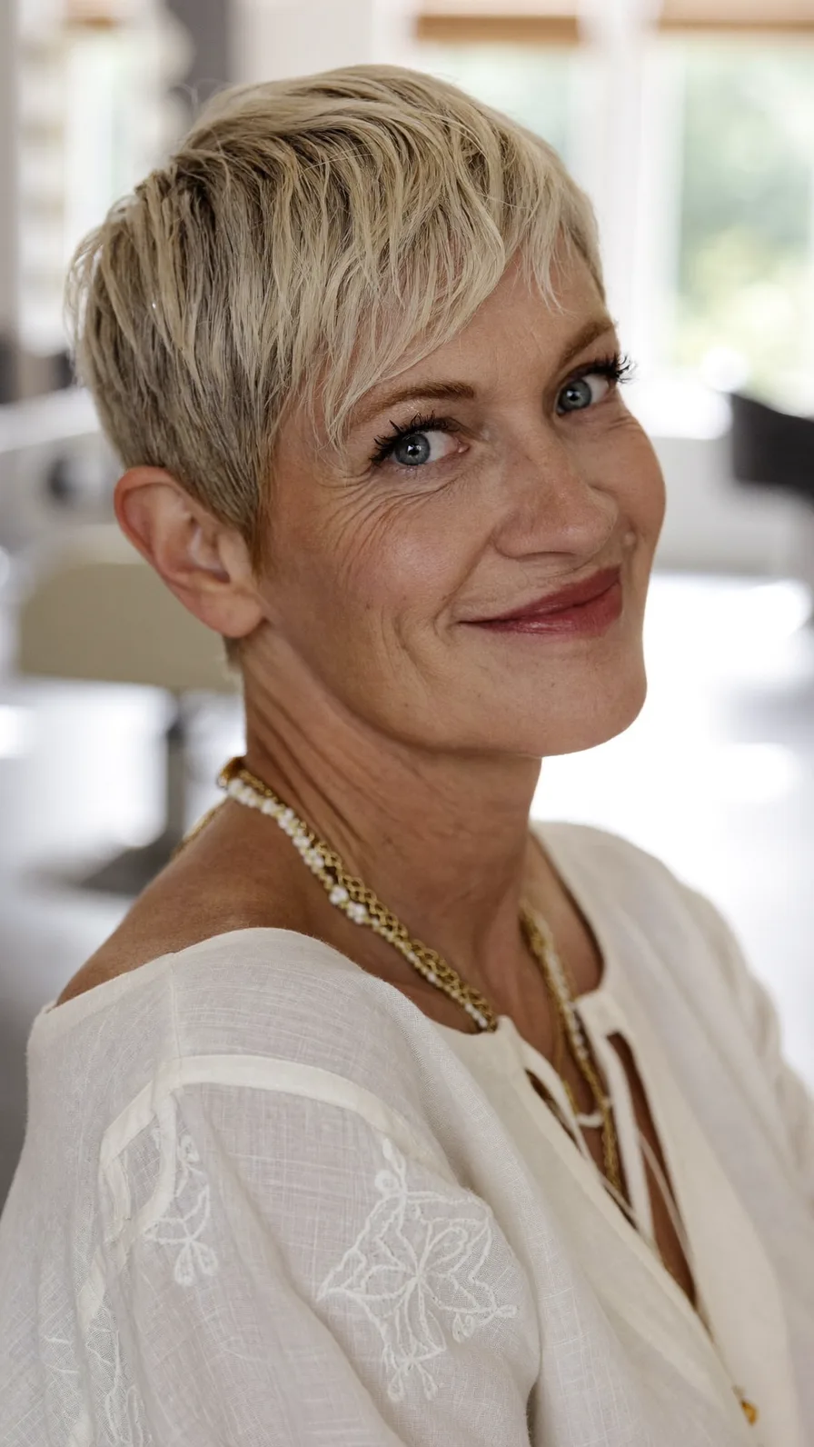 Chic Textured Ash Blonde Pixie with Soft Wispy Bangs