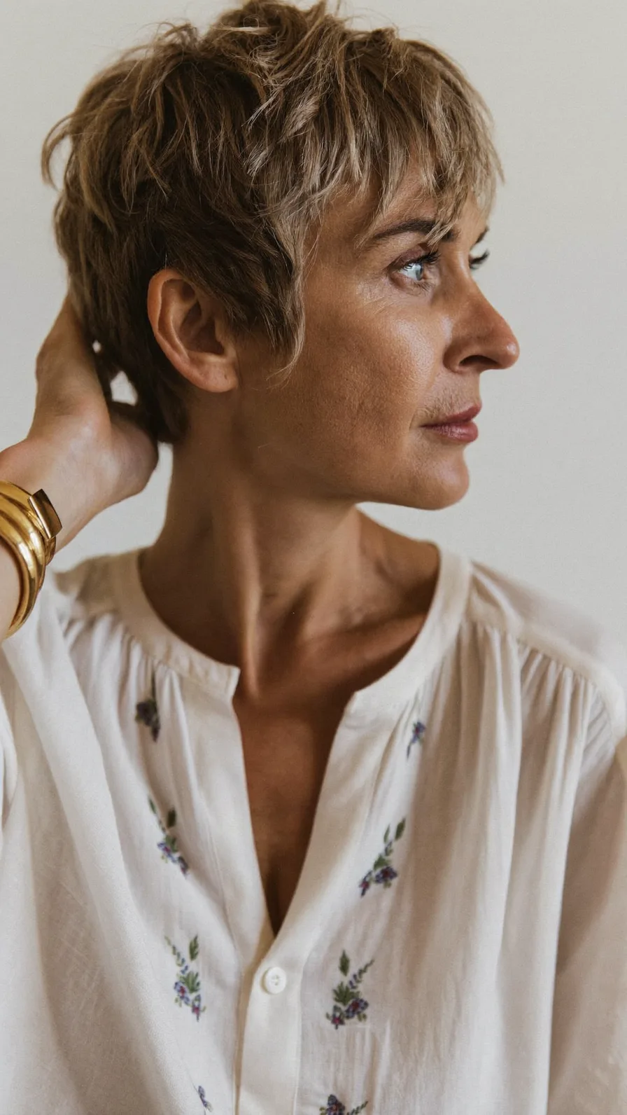 Modern Textured Pixie Cut with Wispy Side-Swept Bangs