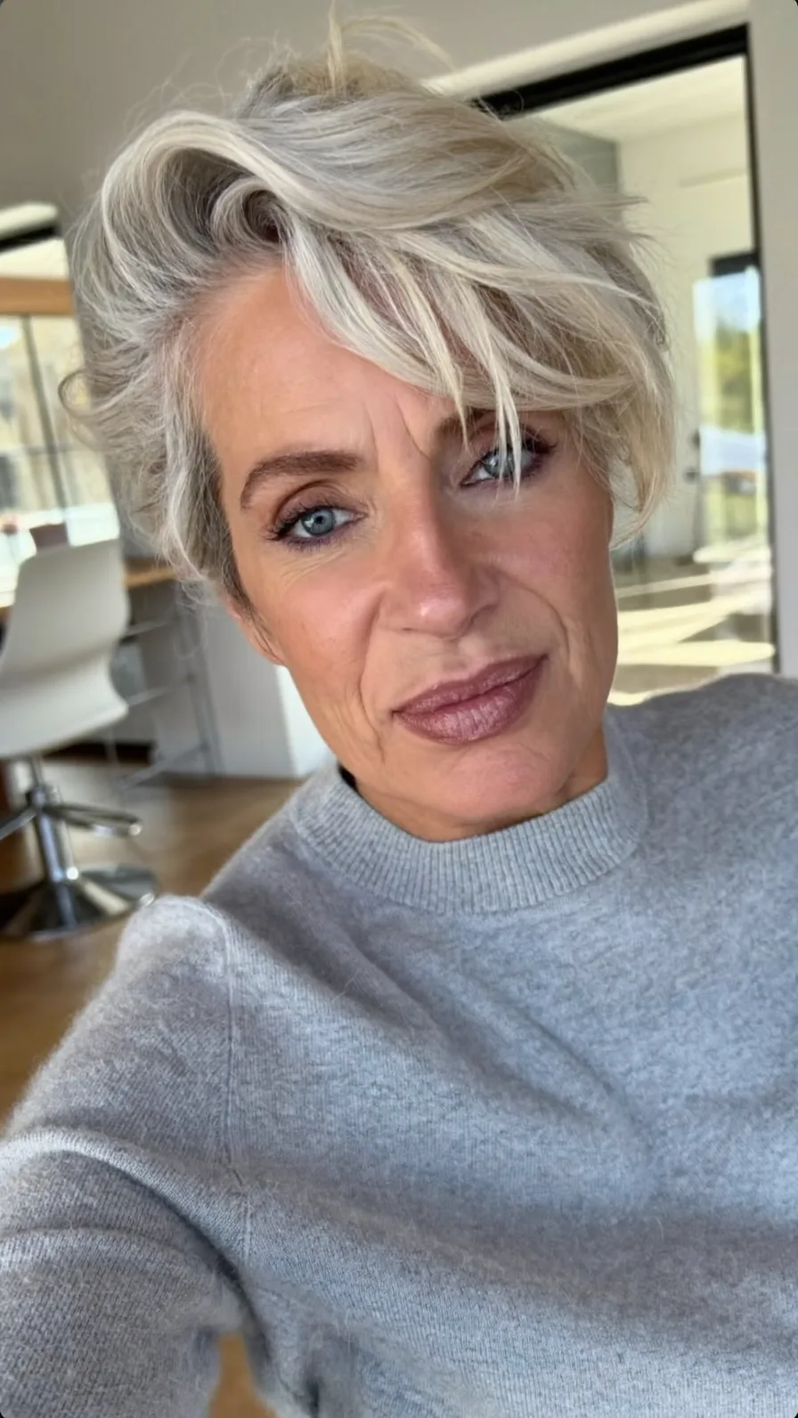 Voluminous Textured Short Platinum Blonde Layered Hairstyle