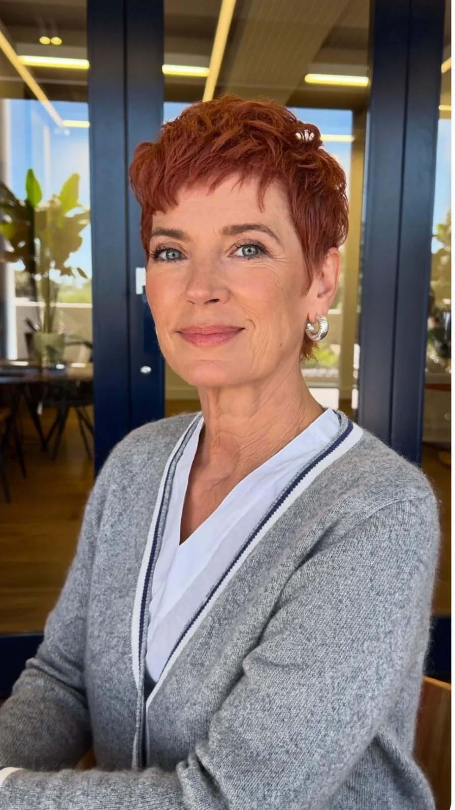 Textured Auburn Pixie with Micro Bangs for Mature Women