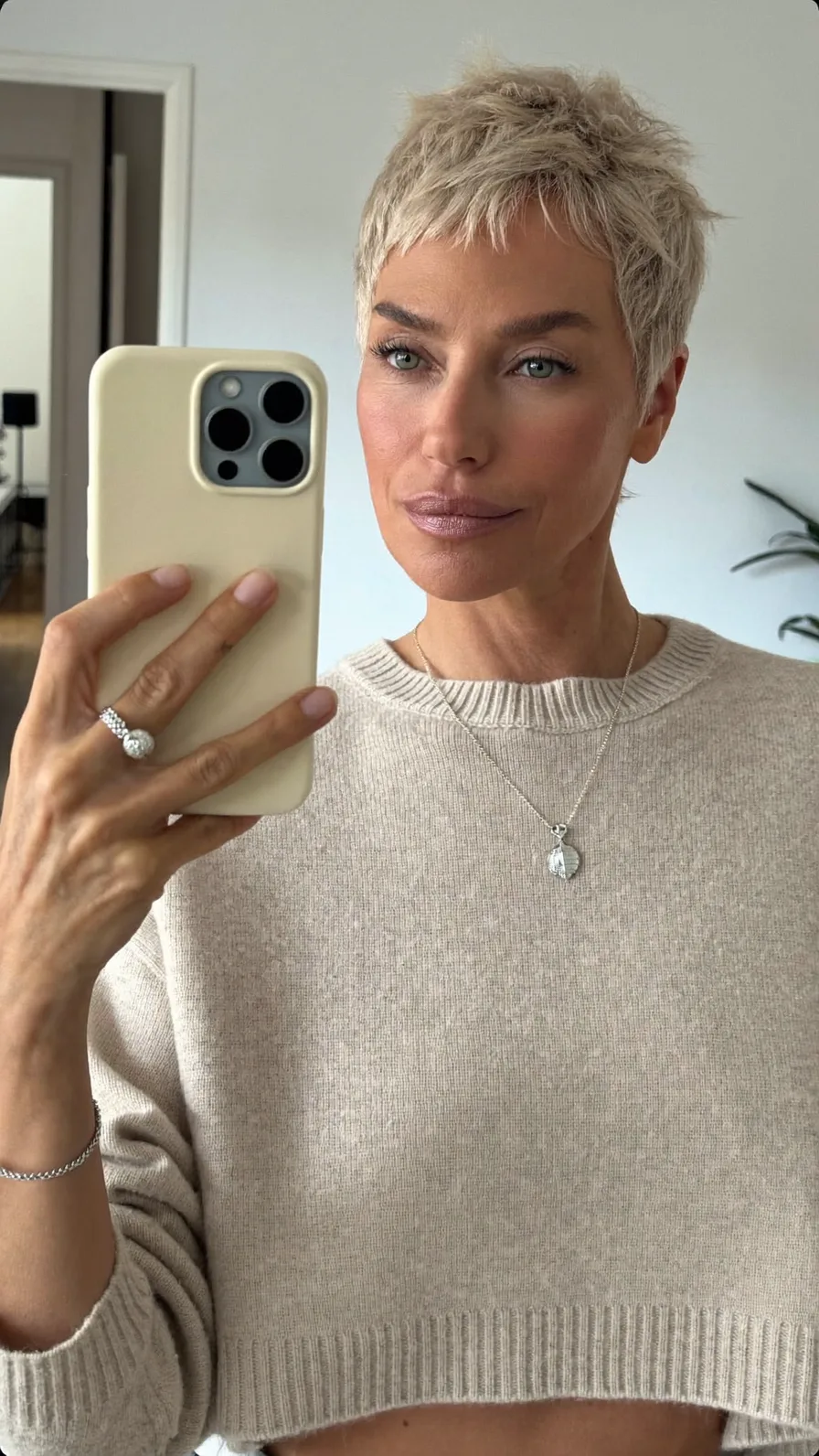 Choppy Textured Platinum Blonde Pixie Cut with Micro Bangs