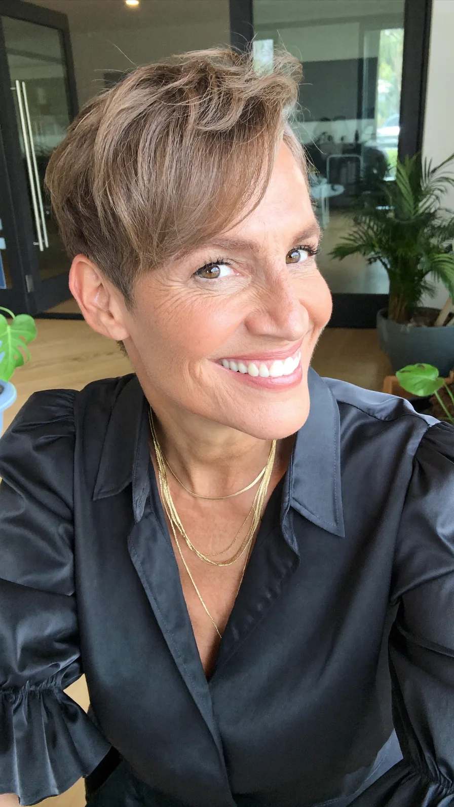 Modern textured short pixie with side-swept bangs for women