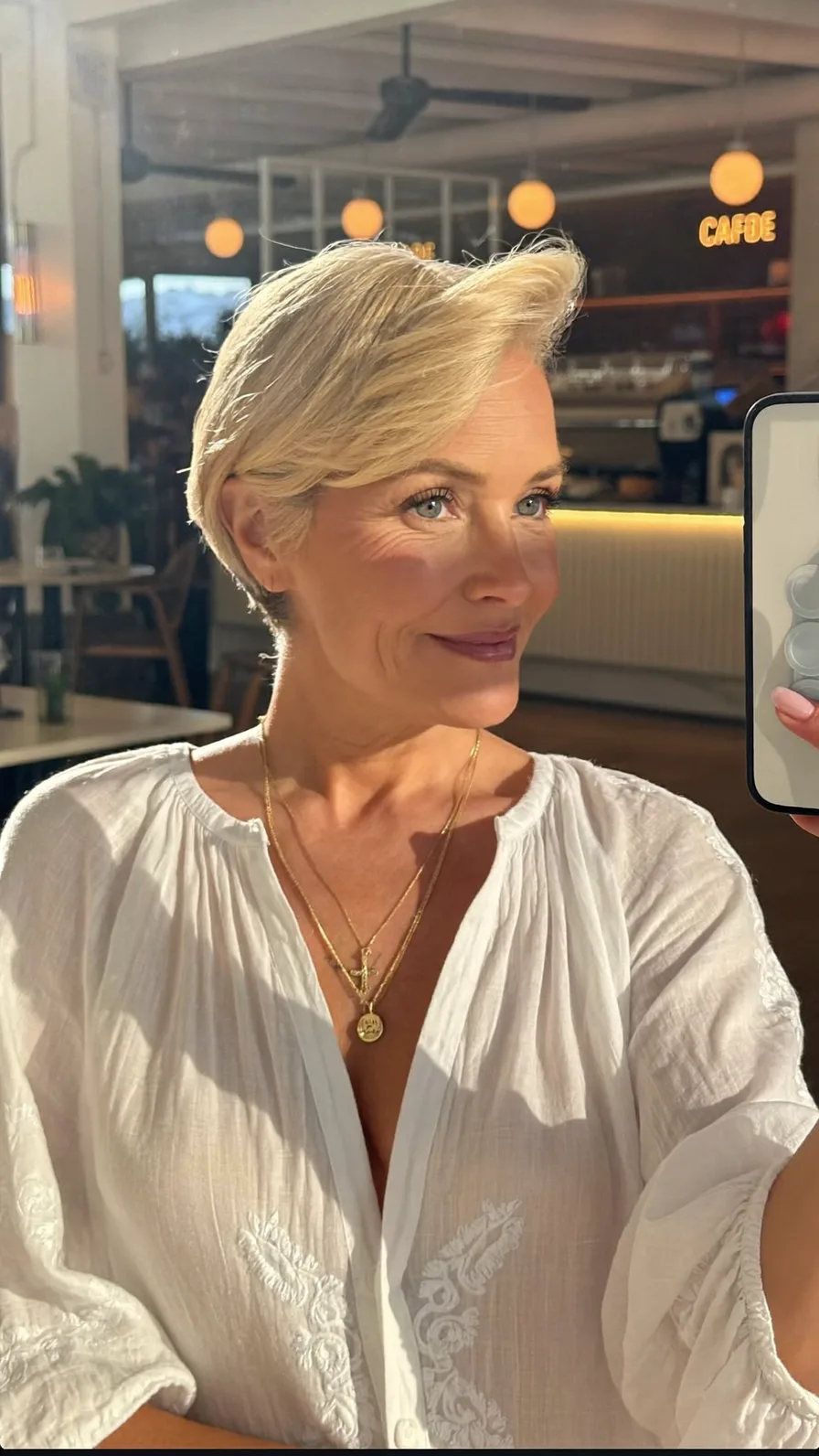 Sophisticated Platinum Blonde Pixie with Side-Swept Layers