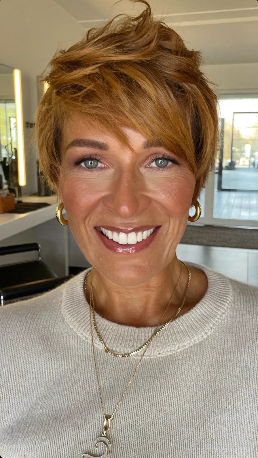 Textured Voluminous Short Layered Haircut with Side-Swept Bangs