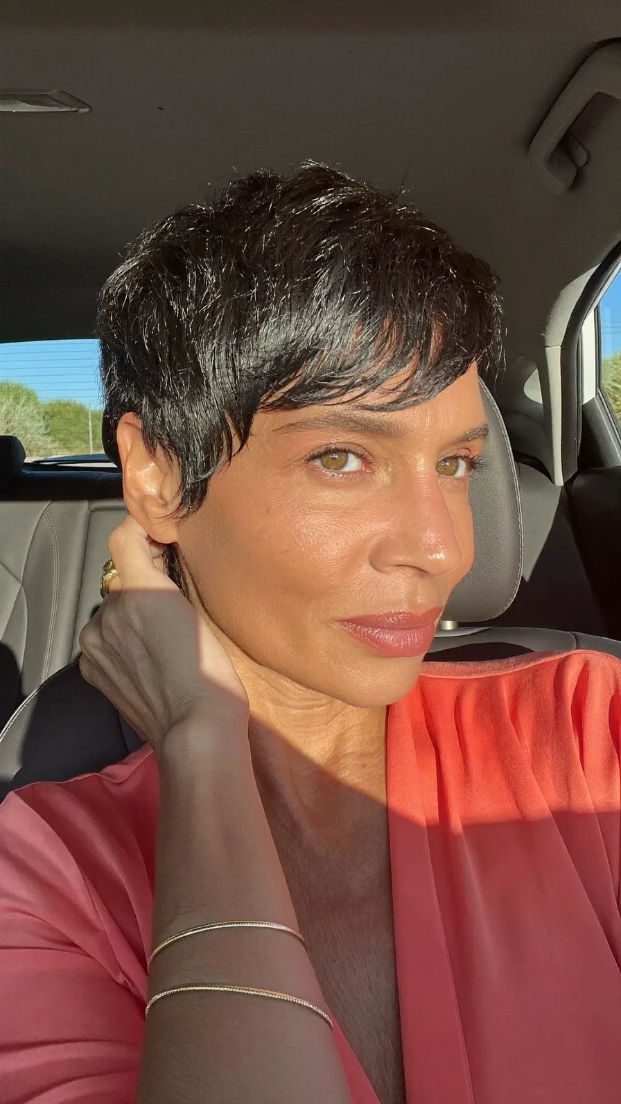 Textured Black Pixie with Side-Swept Bangs for Oval Faces
