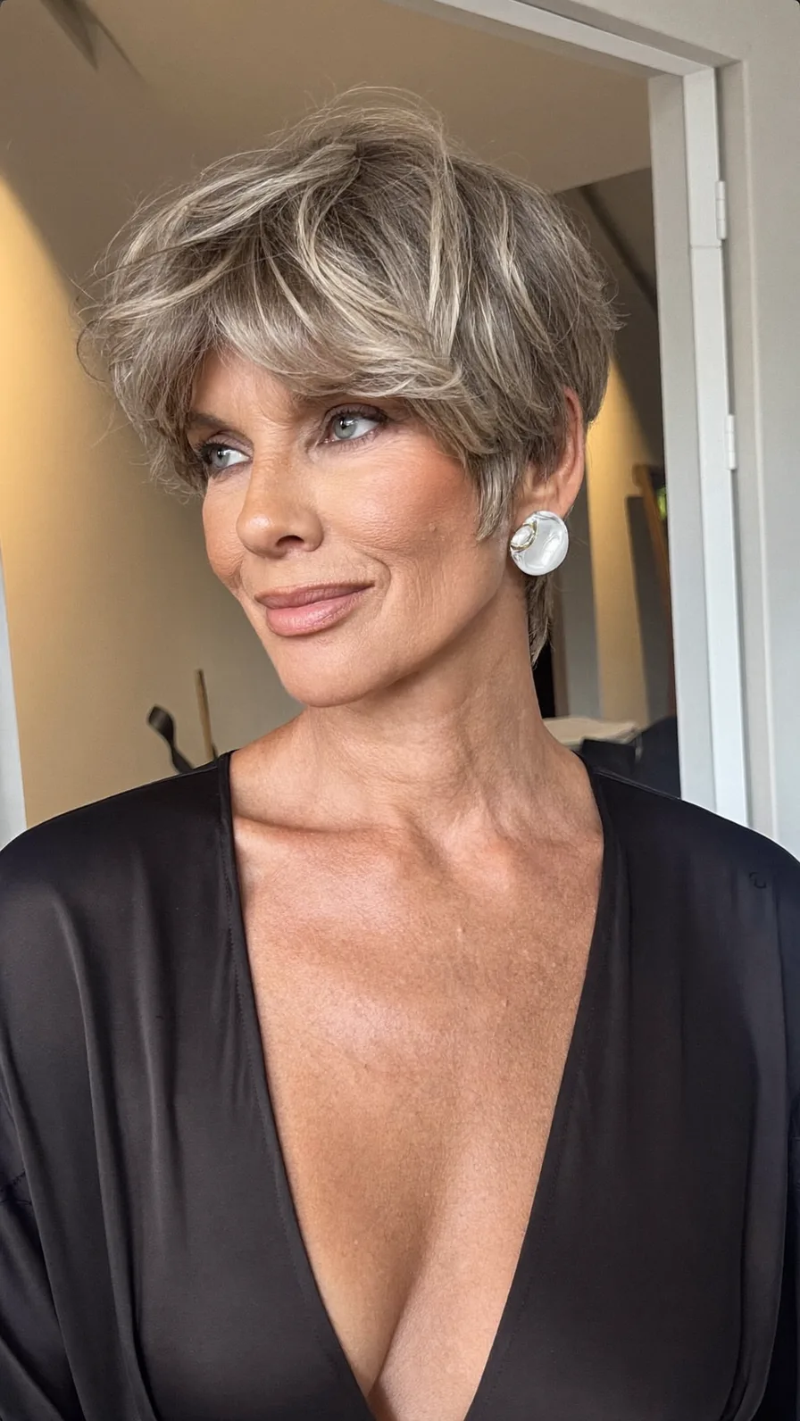 Voluminous Feathered Short Layered Side-Swept Hairstyle