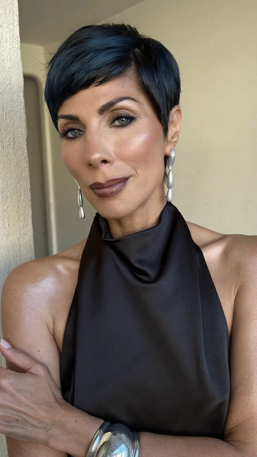 Sleek Jet Black Pixie Cut with Side-Swept Bangs