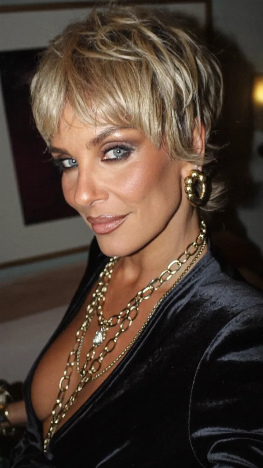 Textured Blonde Pixie Cut with Wispy Side-Swept Bangs
