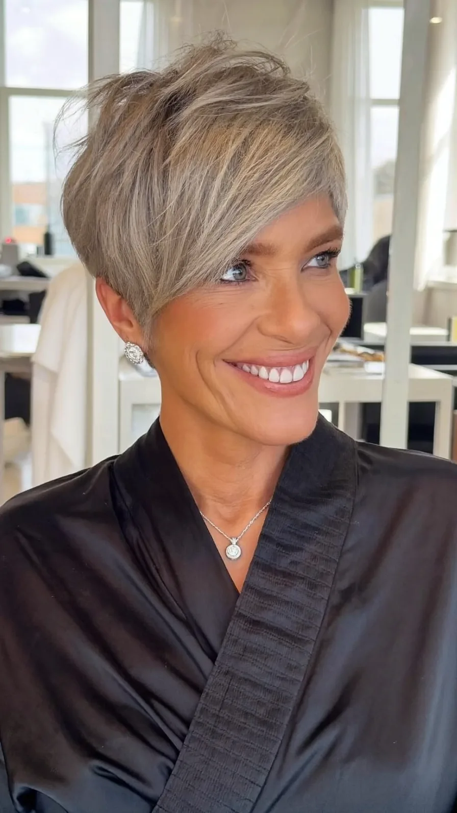 Chic Asymmetric Pixie Cut with Feathered Layers and Silver Tones