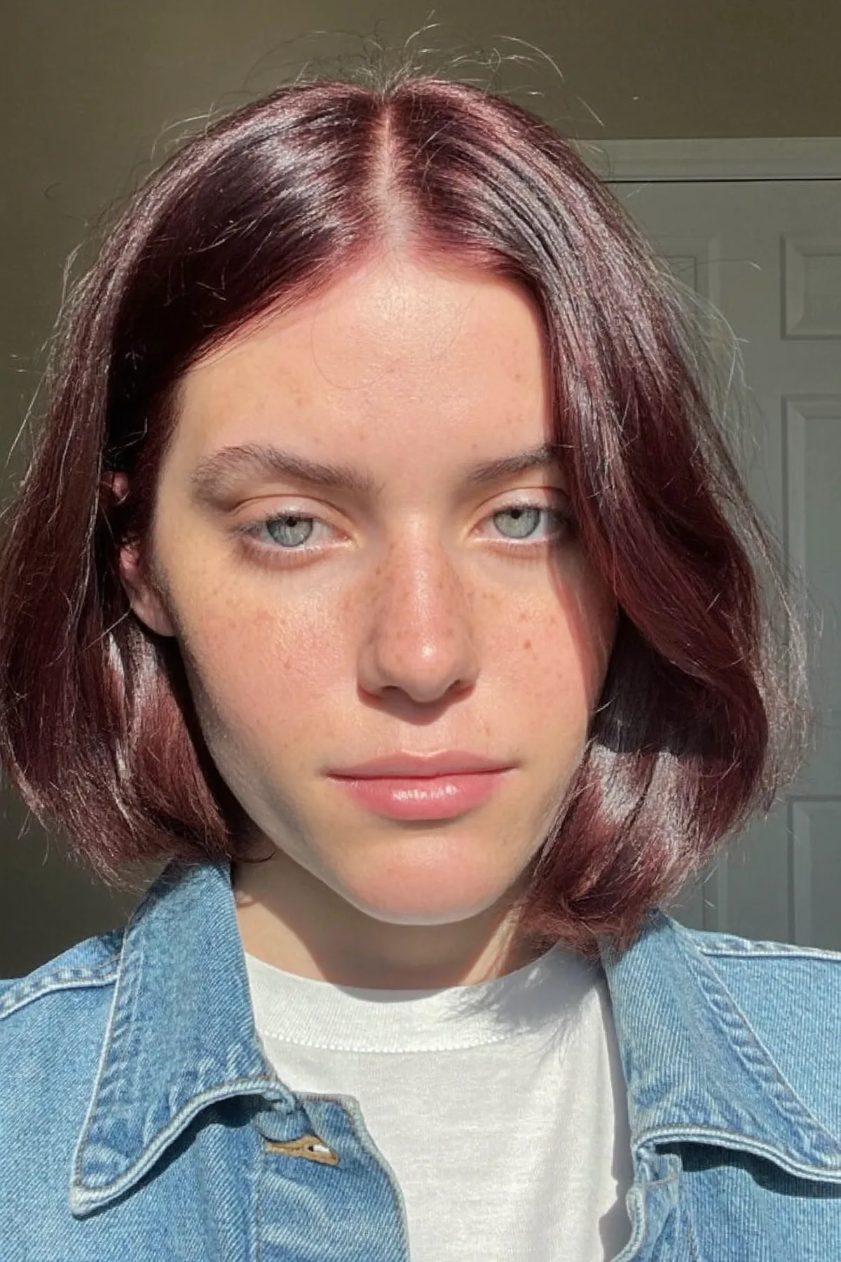 Sleek Vivid Red Chin-Length Bob with Solid Burgundy Shine