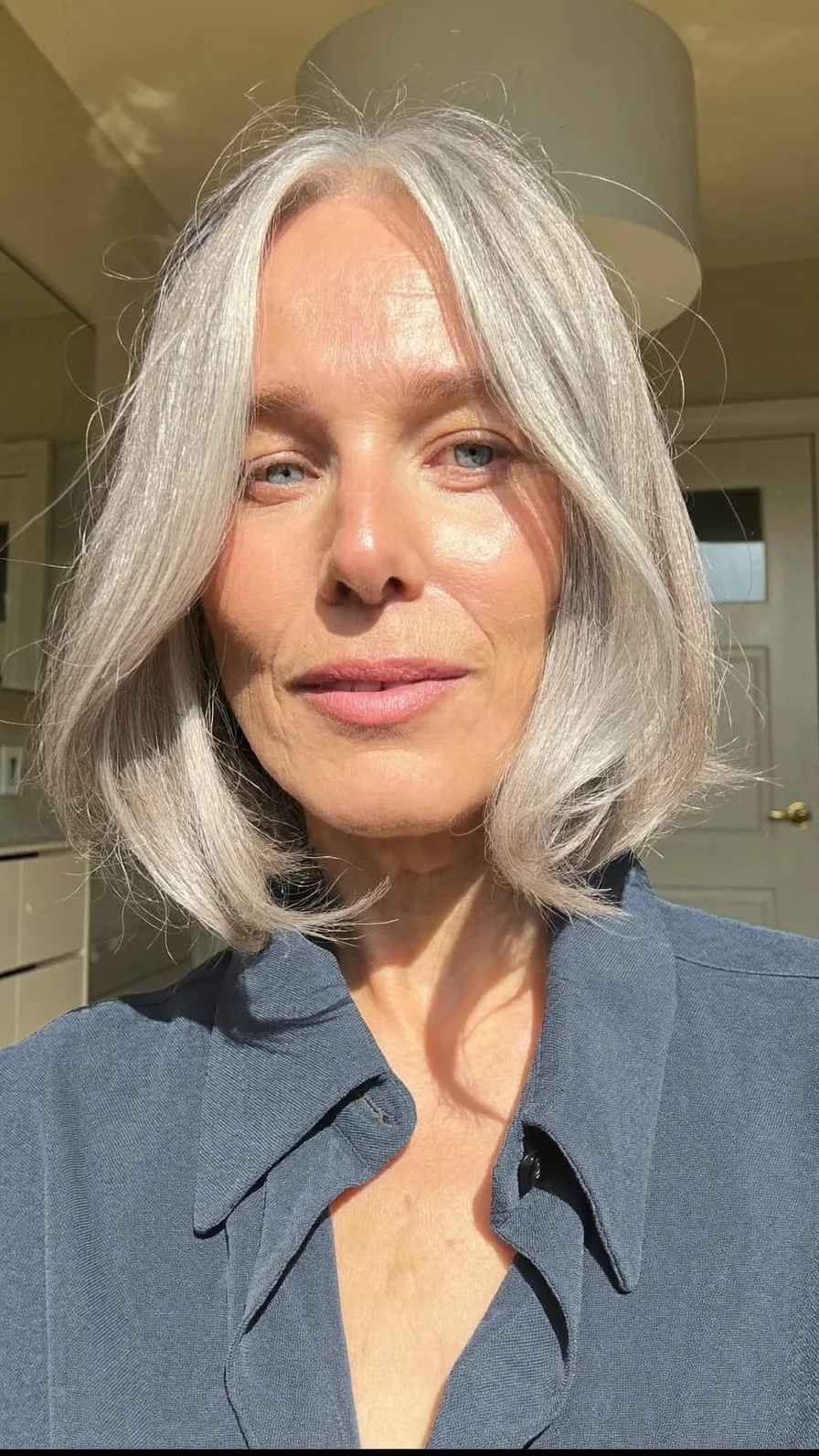 Elegant Center-Parted Chin-Length Silver Bob with Curtain Bangs