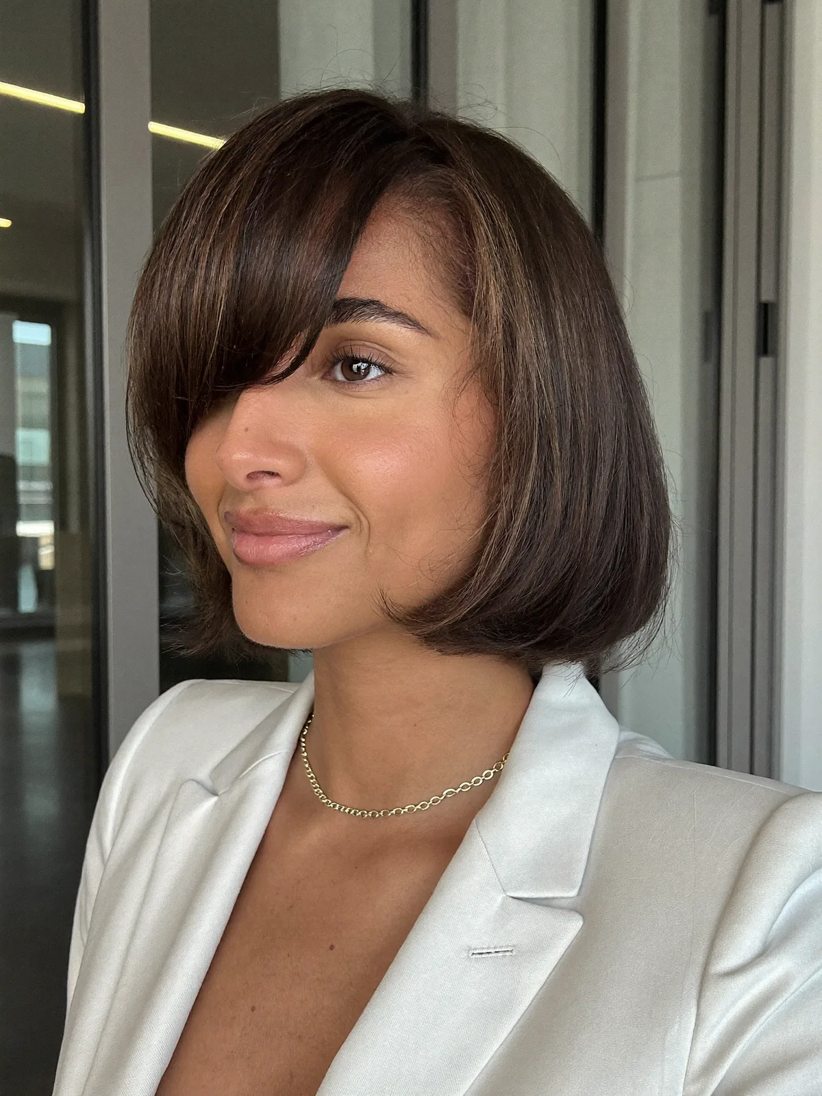 Warm Brunette Sleek French Bob With Face-Framing Heavy Fringe