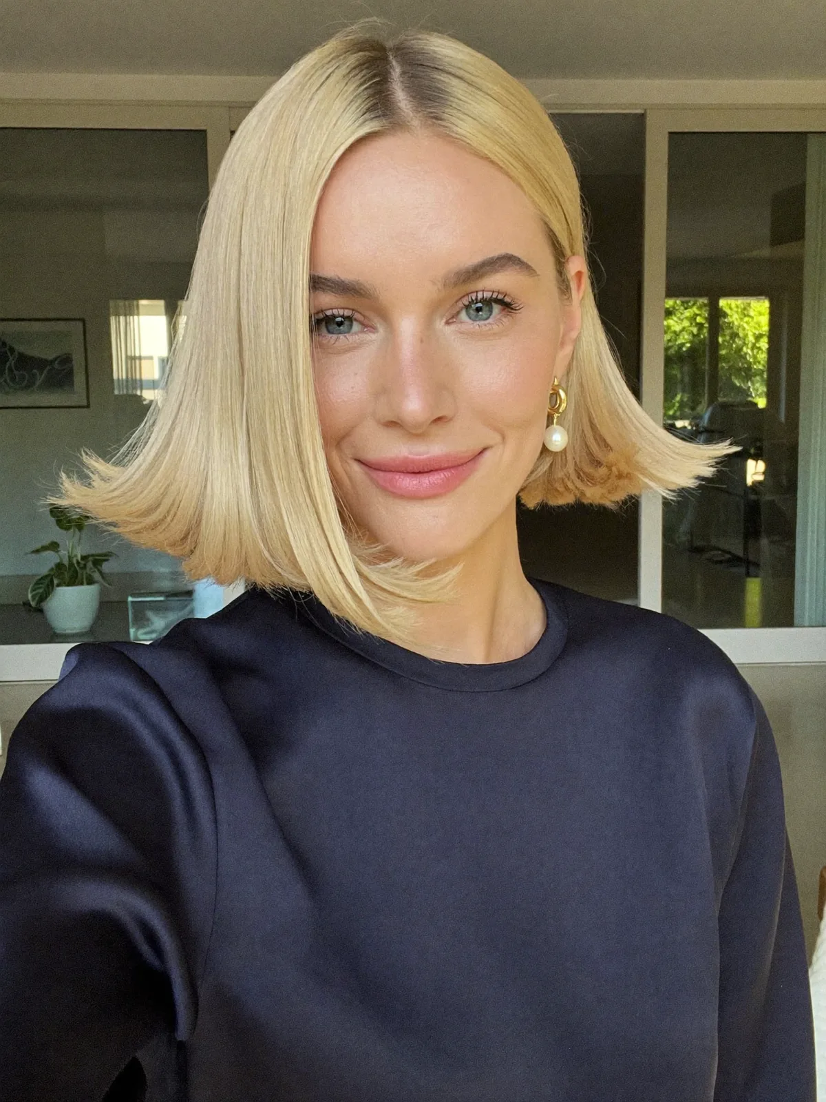 Sleek Platinum Blonde Blunt Bob with Flipped-Out Ends