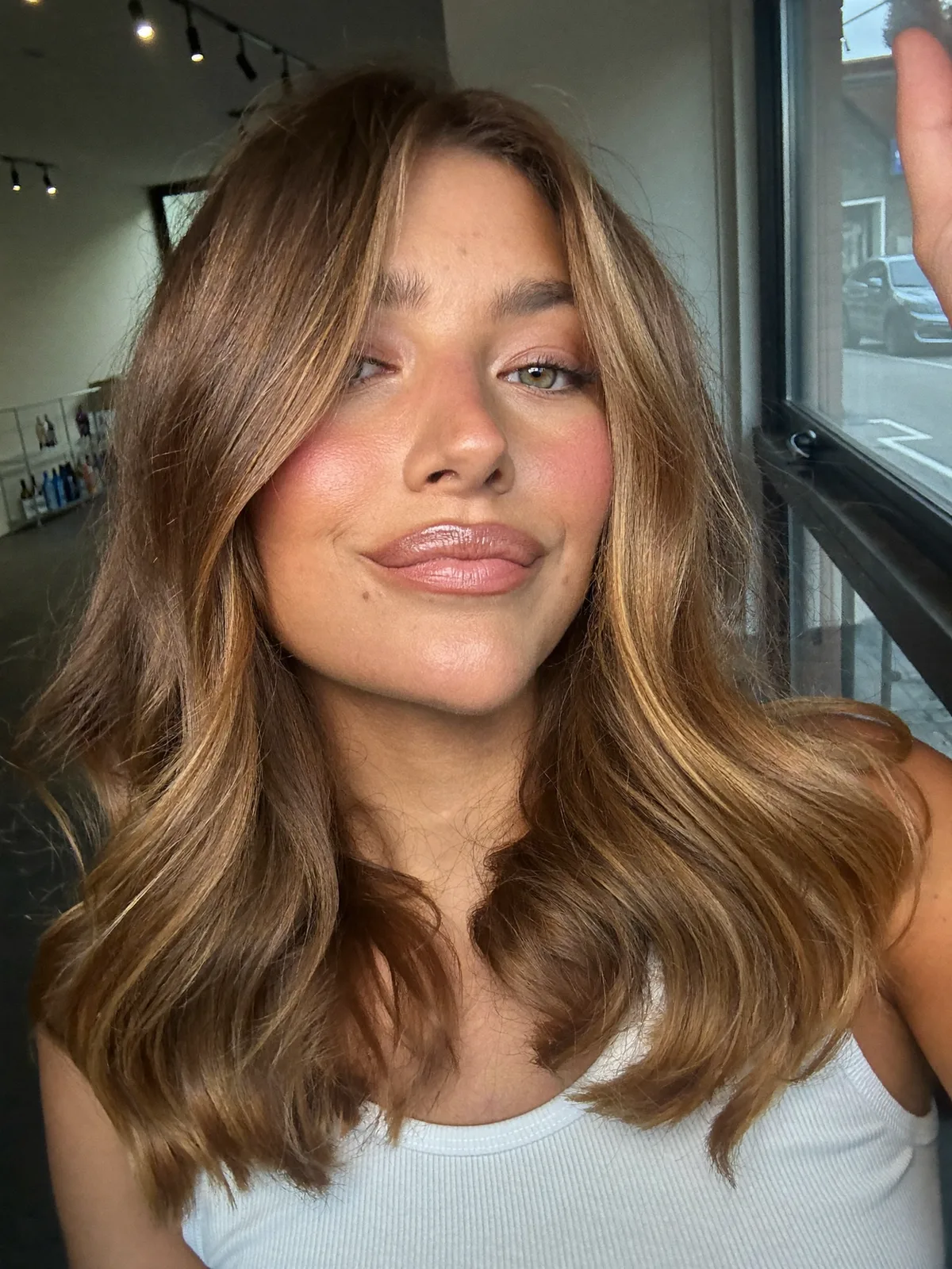 Soft Mid-Length Waves in Warm Caramel Brown with Face-Framing Layers