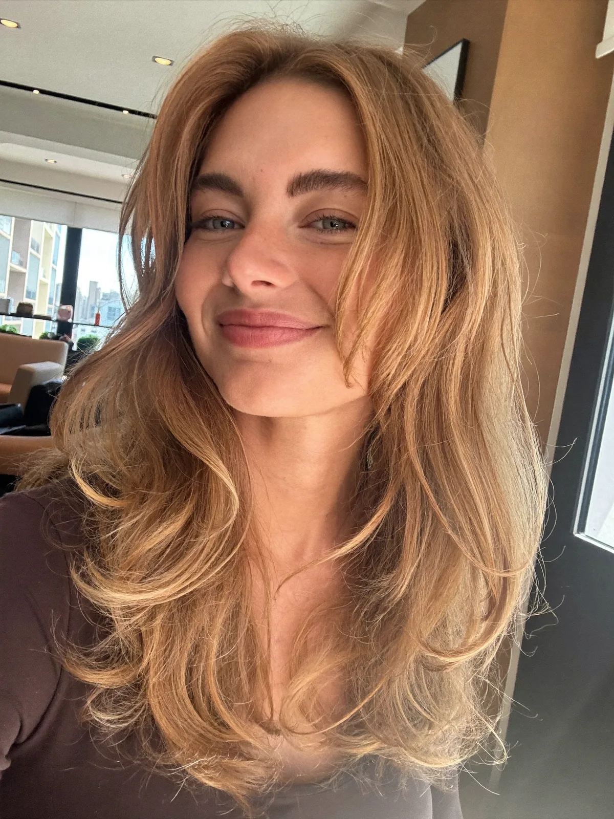 Layered Blowout with Warm Caramel Brown Balayage Highlights