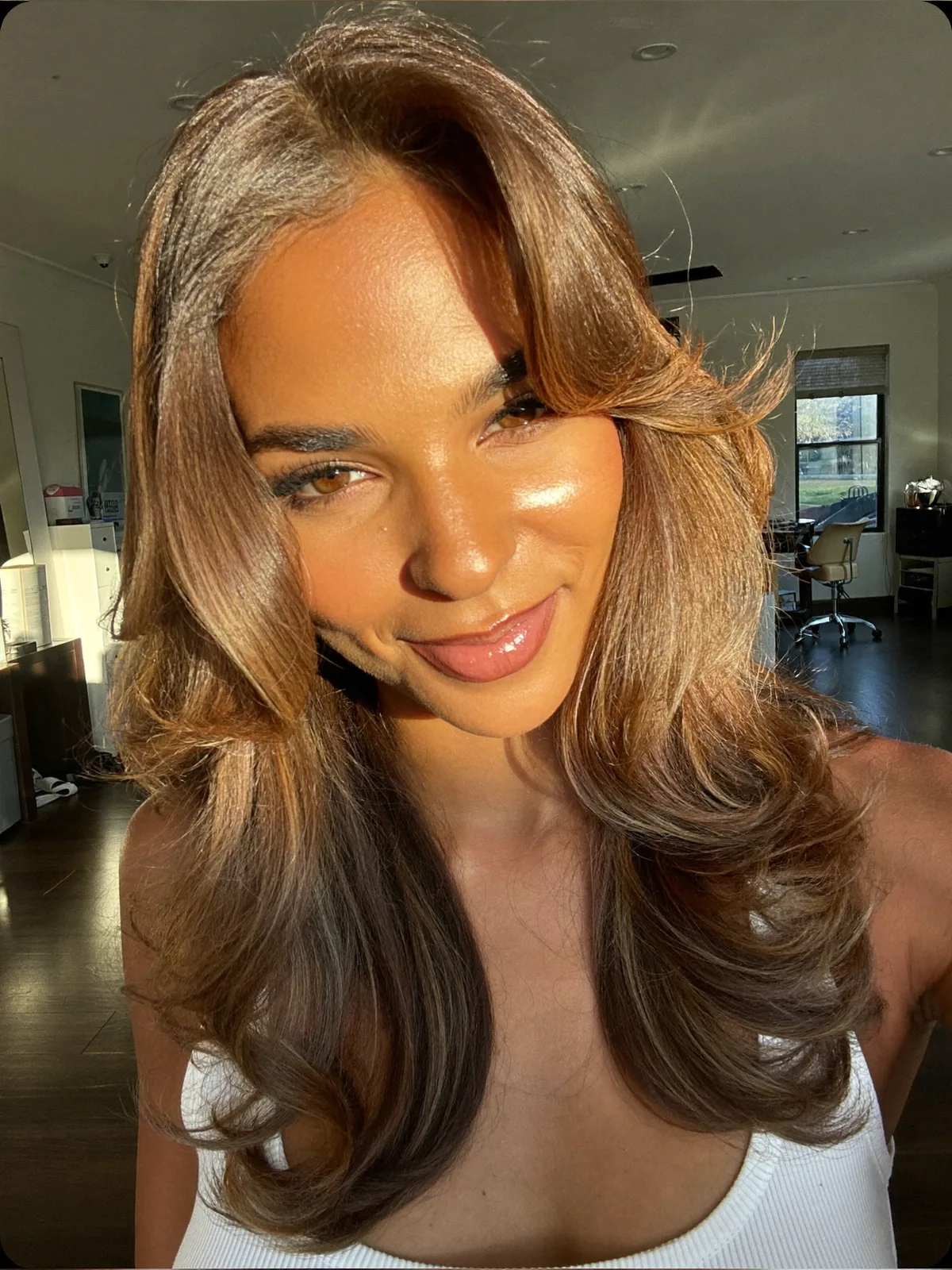 Sunlit Layers With Face-Framing Warm Caramel Brown Blowout
