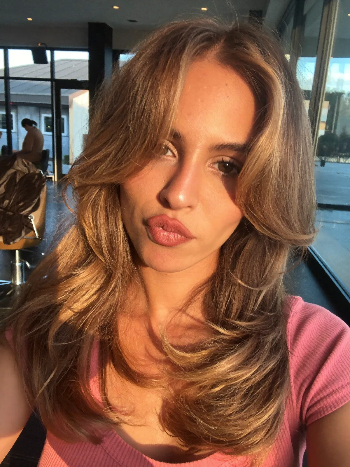 Voluminous Layered Cut with Warm Caramel Brown Balayage Highlights