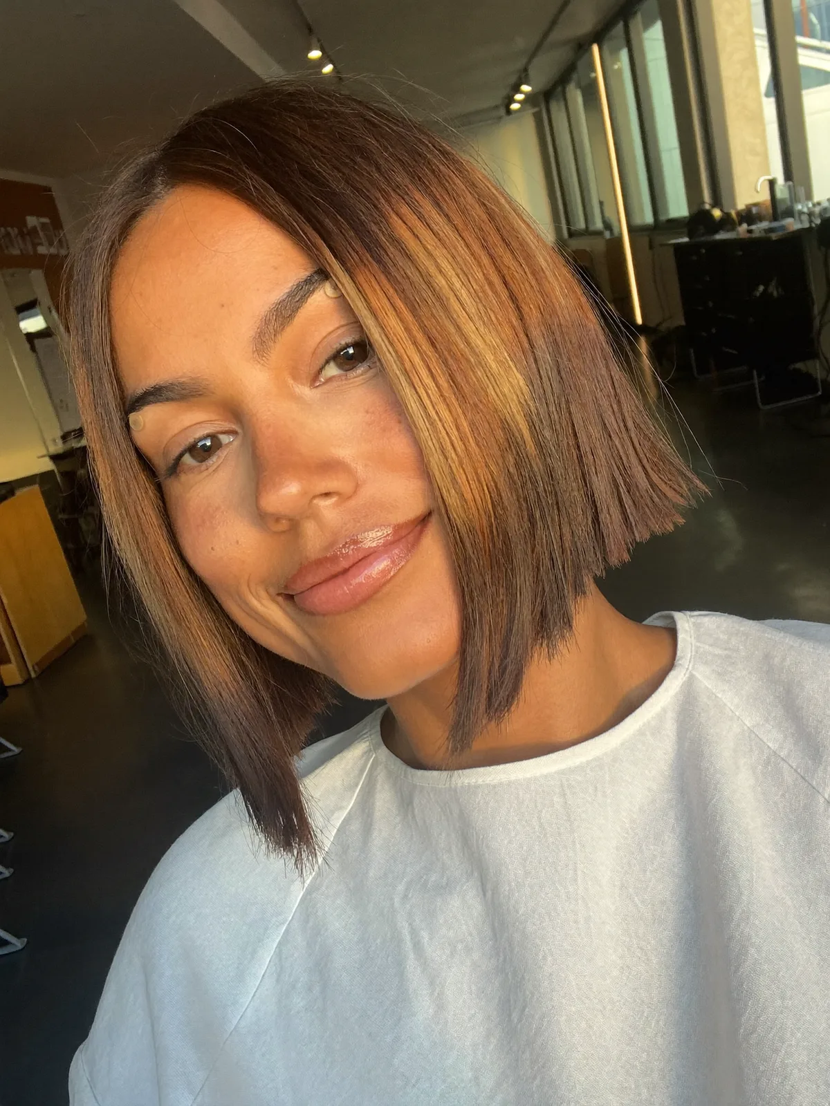 Sleek Angled Bob with Sunlit Warm Caramel Brown Highlights