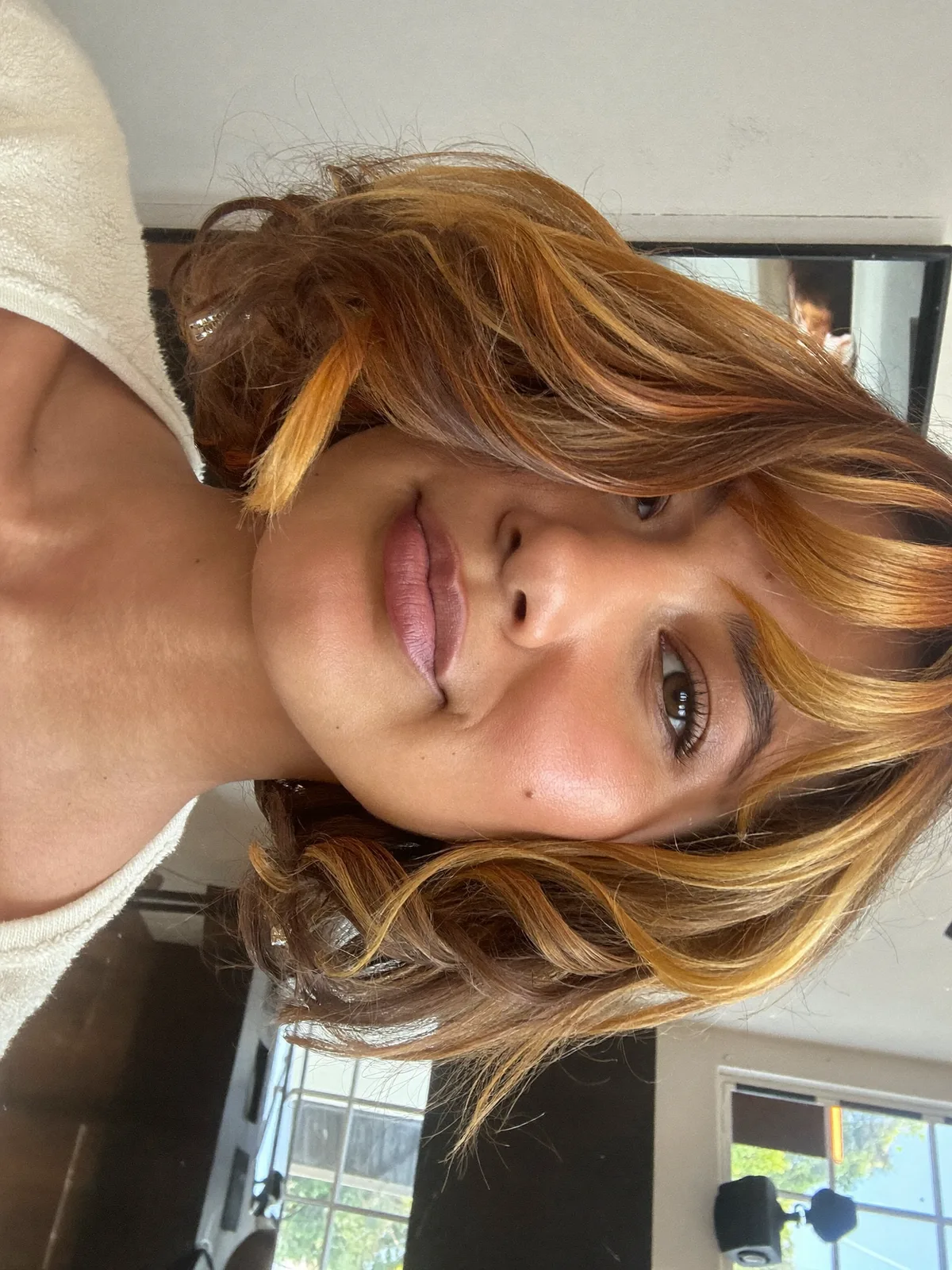 Modern Wavy Bob with Warm Caramel Brown Highlights and Face-Framing Layers