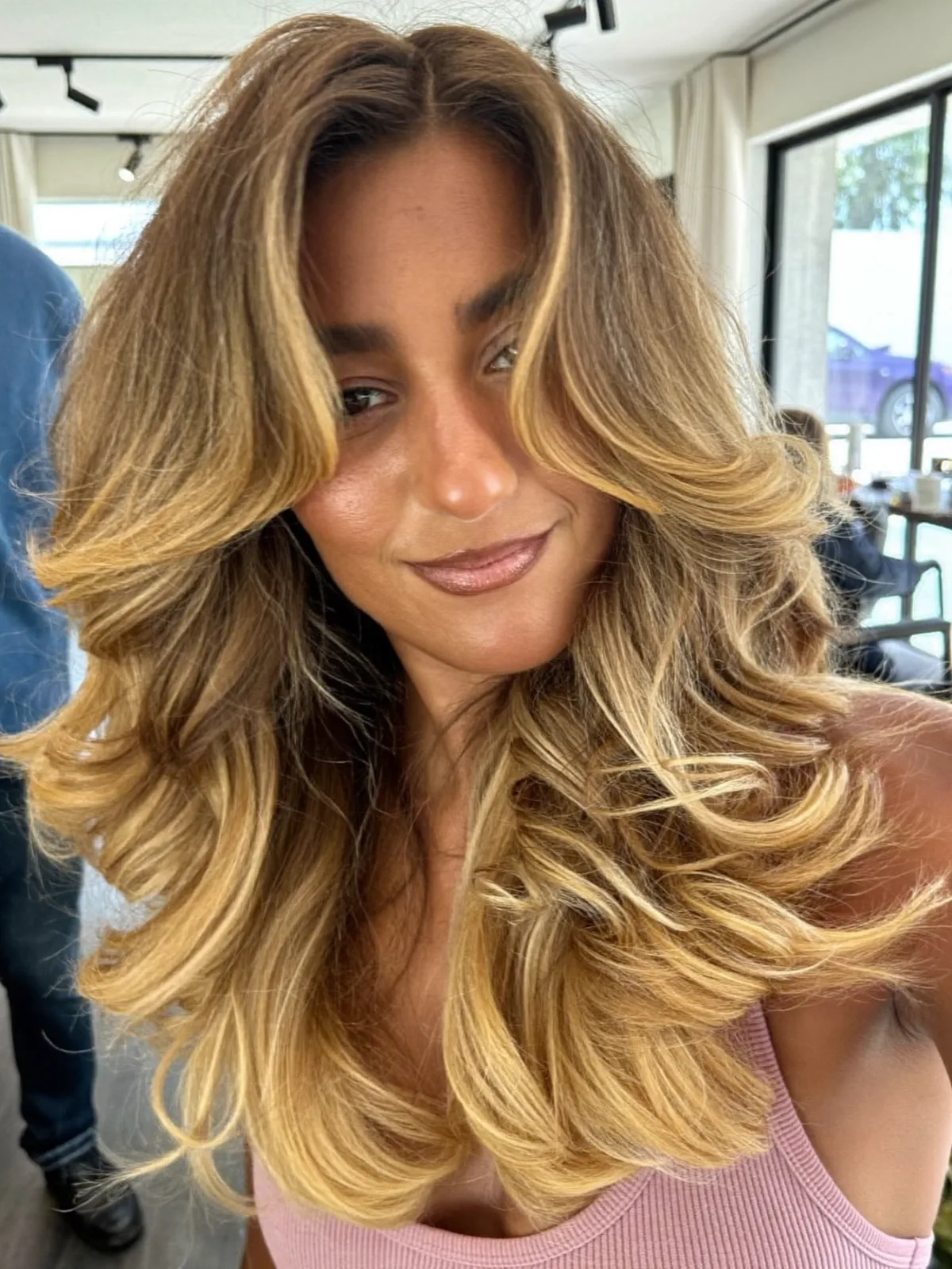 Voluminous Soft Layers with Warm Caramel Brown Balayage Highlights