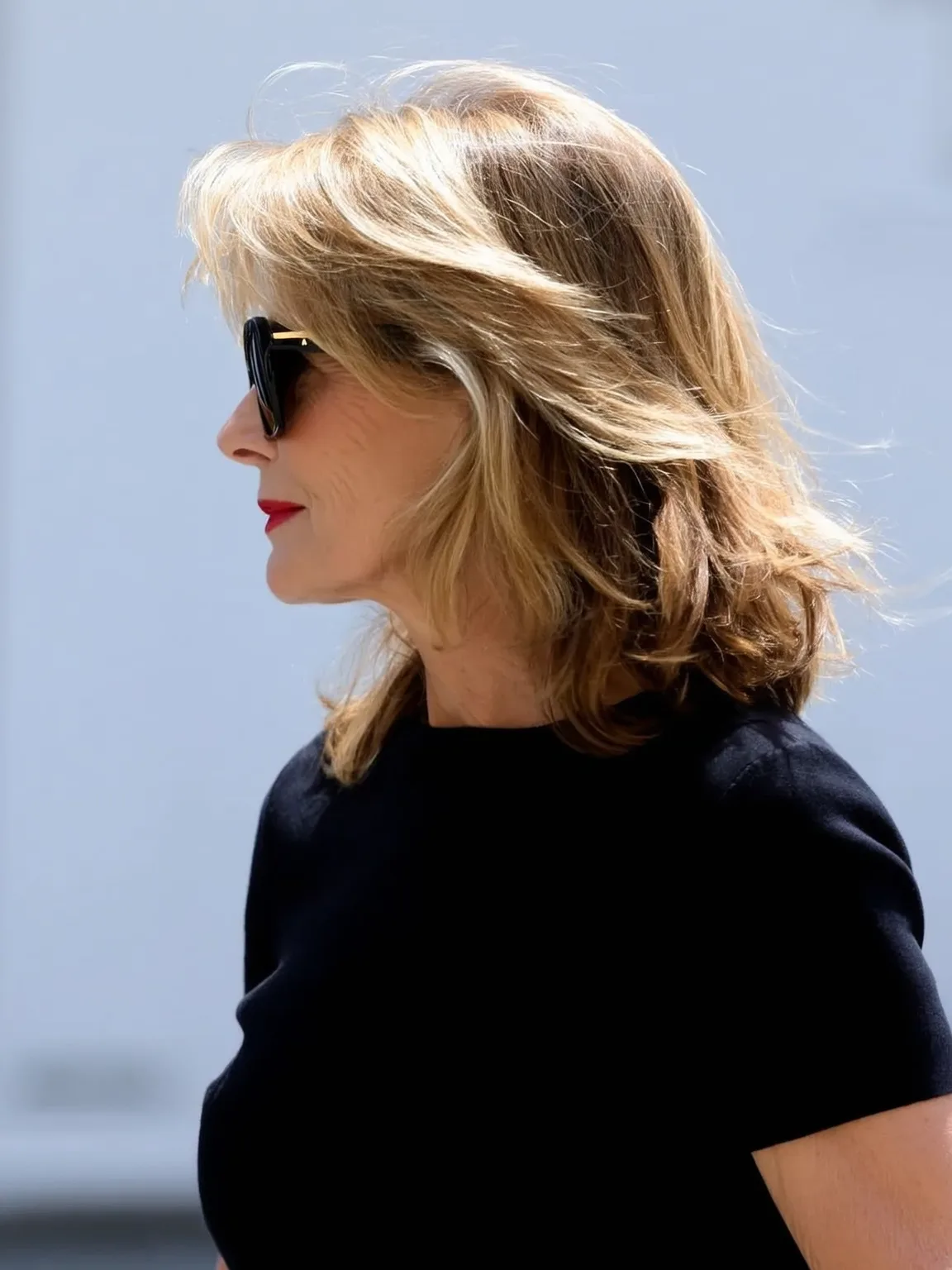 Medium-Length Layered Waves with Side-Swept Bangs