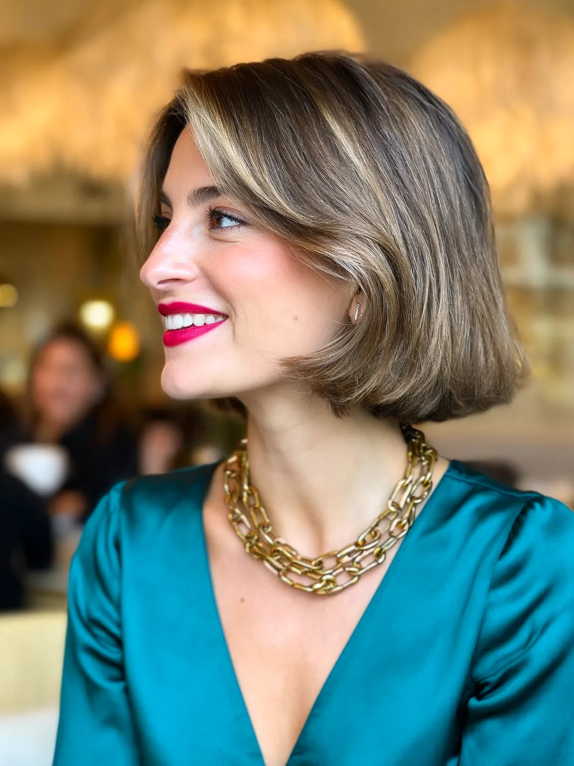 Chin-Length Bob with Side-Swept Bangs and Subtle Highlights