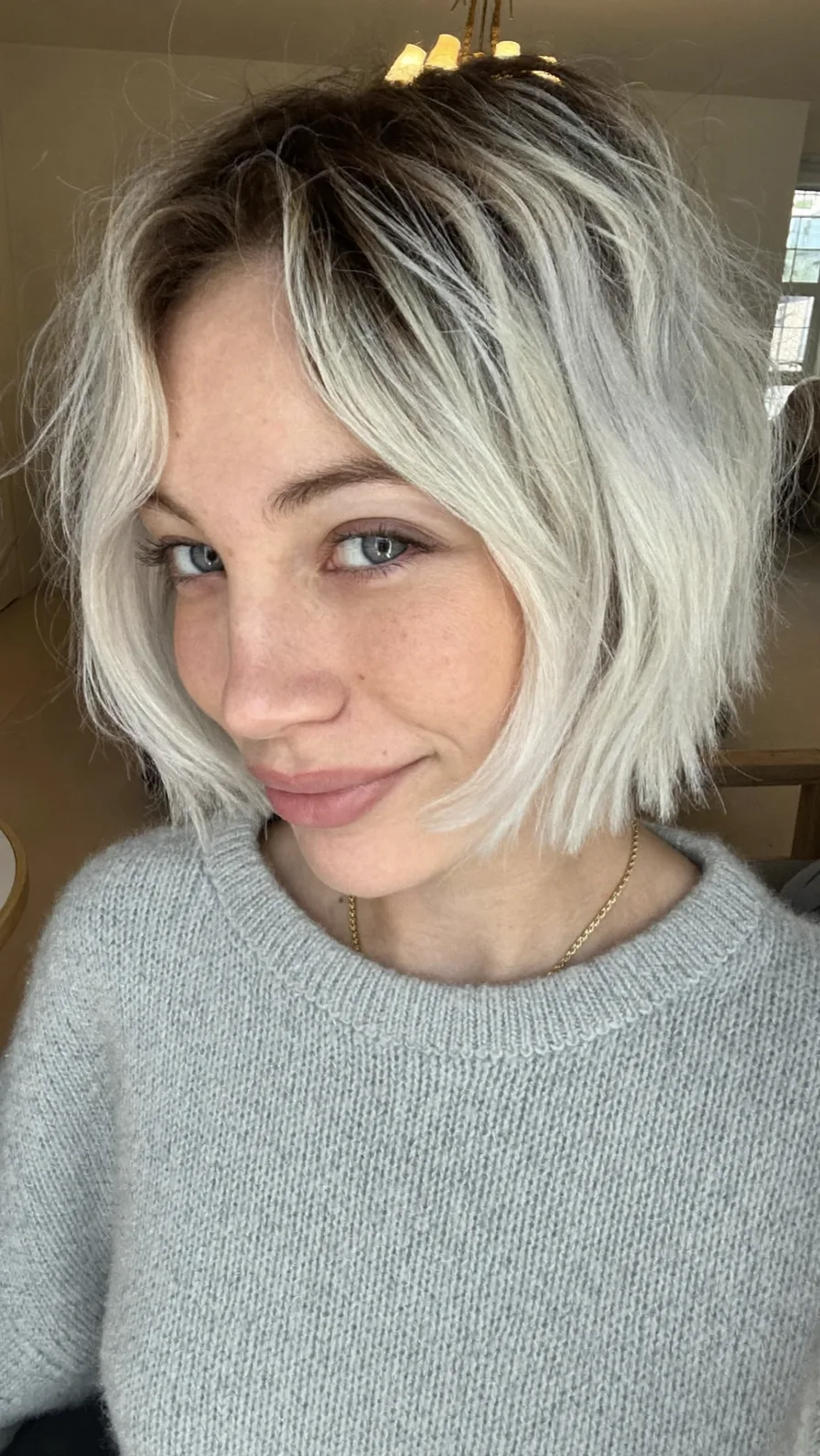 Choppy Textured Platinum Blonde Bob with Curtain Bangs