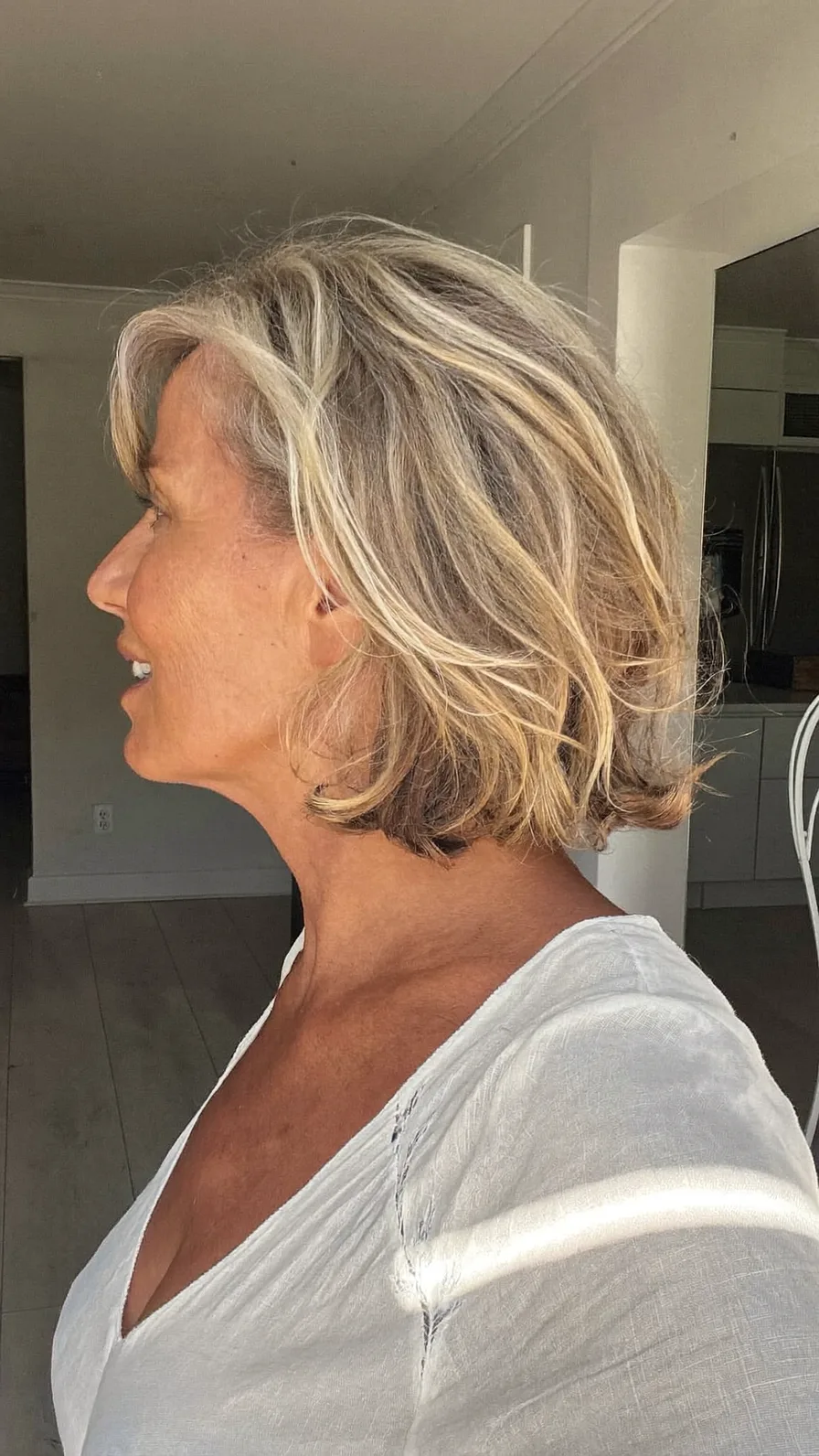 Textured Layered Chin-Length Ash Blonde Bob with Highlights