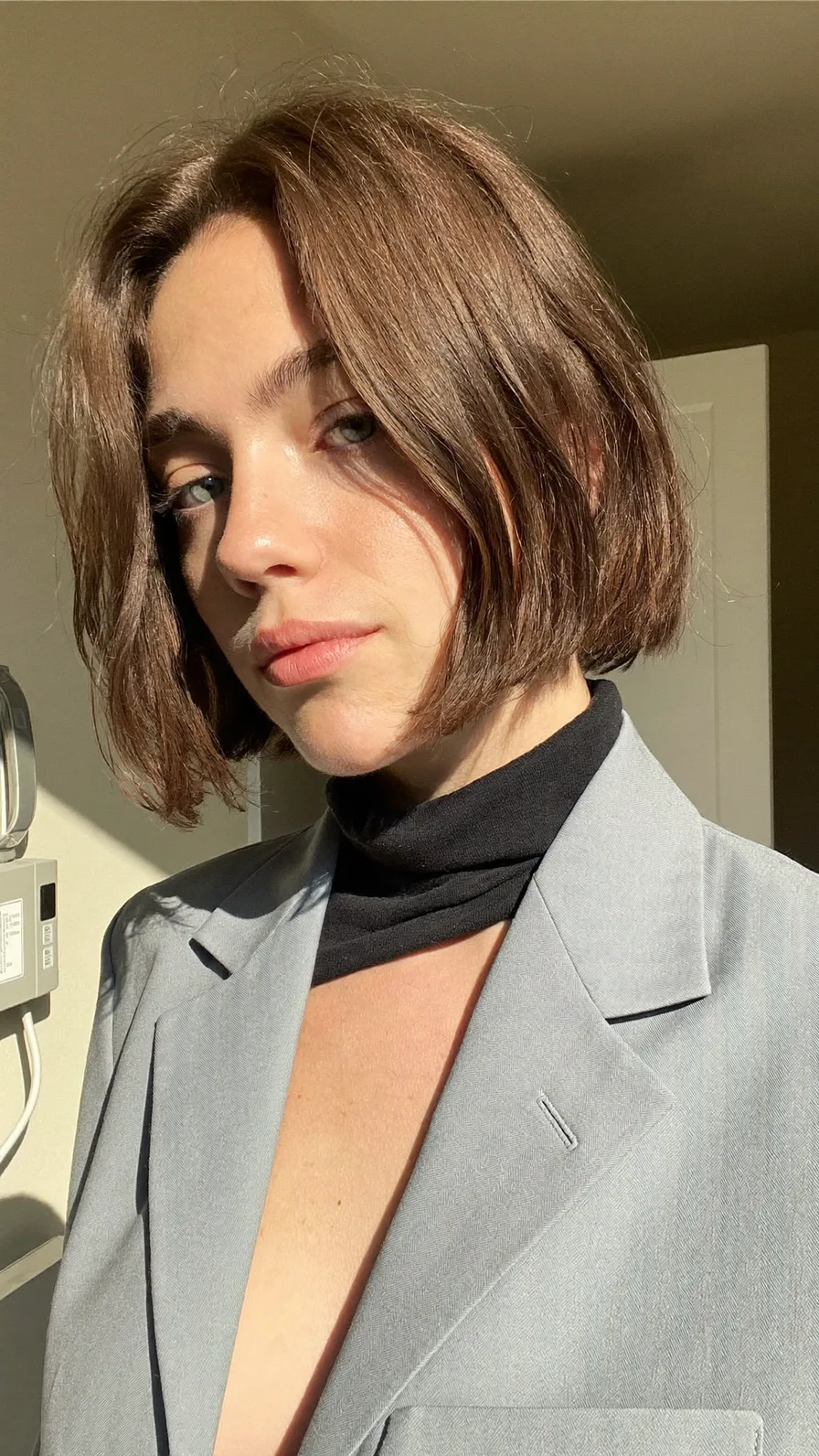 Chic Chin-Length Bob with Subtle Curtain Bangs and Texture