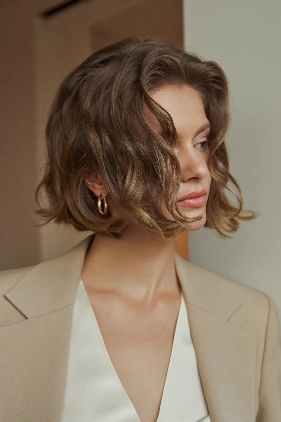 Textured Layered Bob with Side-Swept Waves and Balayage Highlights