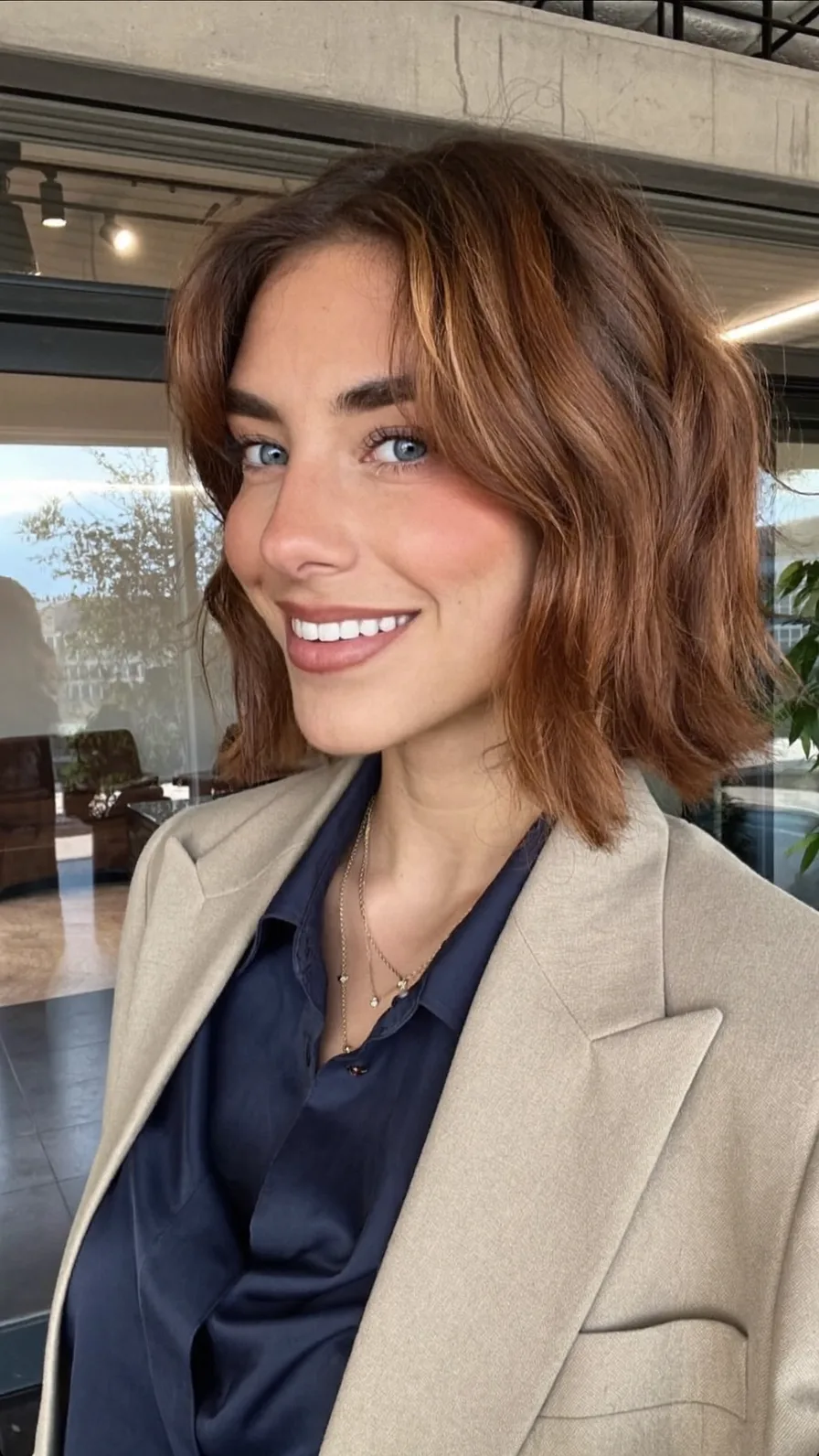 Modern Textured Chin-Length Bob with Warm Caramel Balayage Highlights