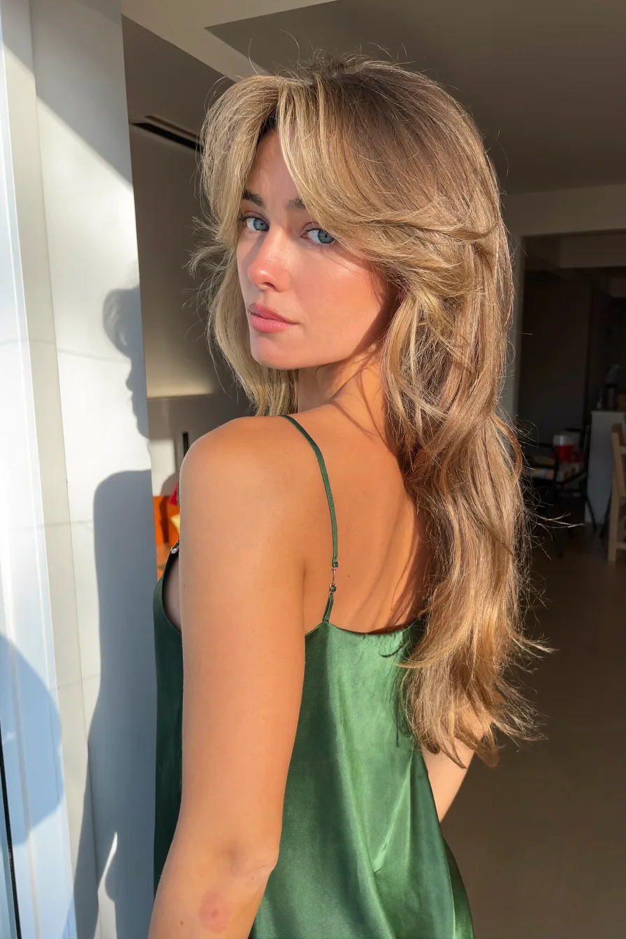 Soft Layered Wavy Blowout with Curtain Bangs for Long Hair
