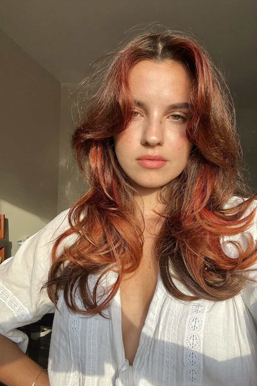 Layered Face-Framing Wavy Cut with Soft Auburn Highlights