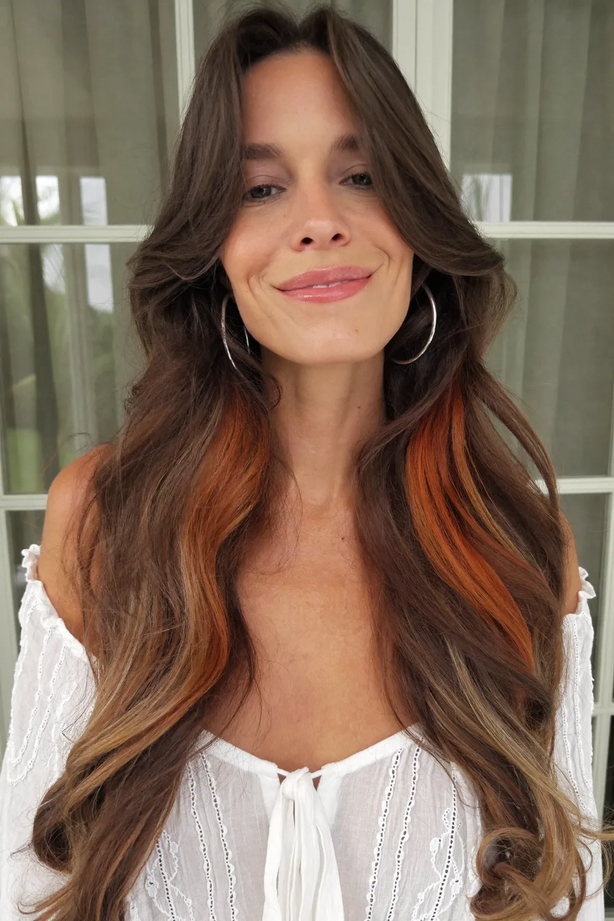 Face-Framing Wavy Layers with Subtle Copper Accents for Long Hair
