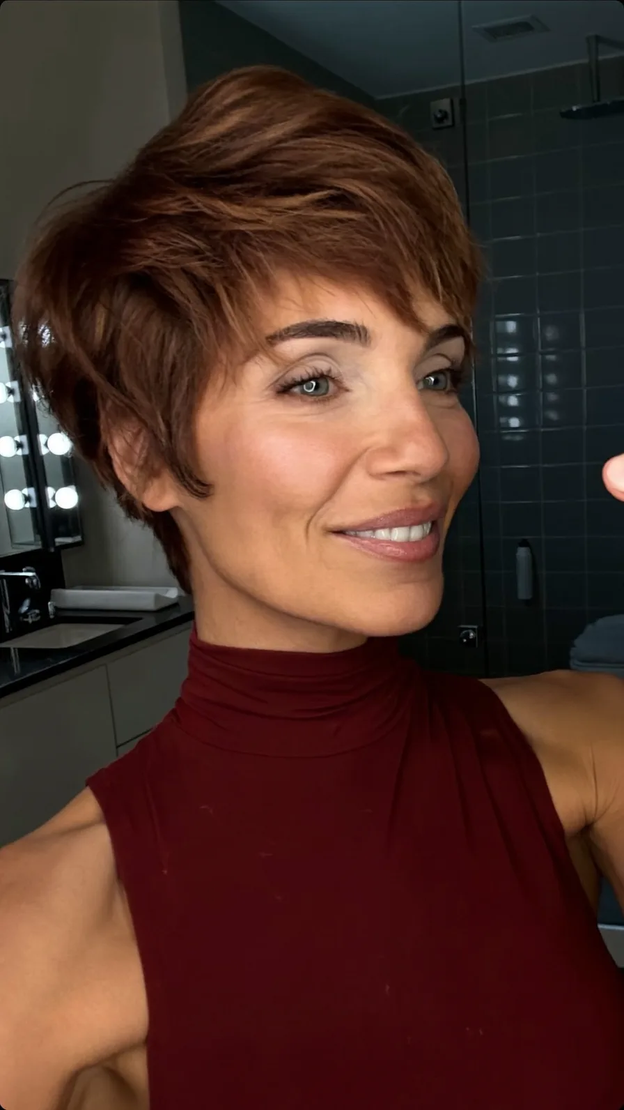 Textured Wavy Pixie with Side-Swept Bangs and Choppy Layers