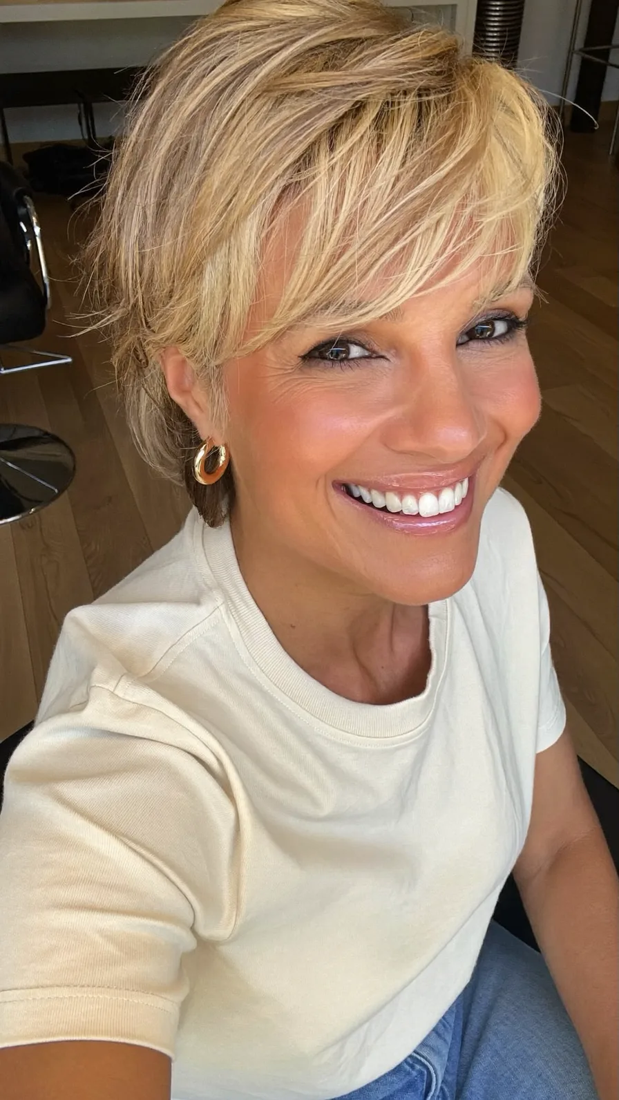 Feathered Honey Blonde Bob with Side-Swept Bangs