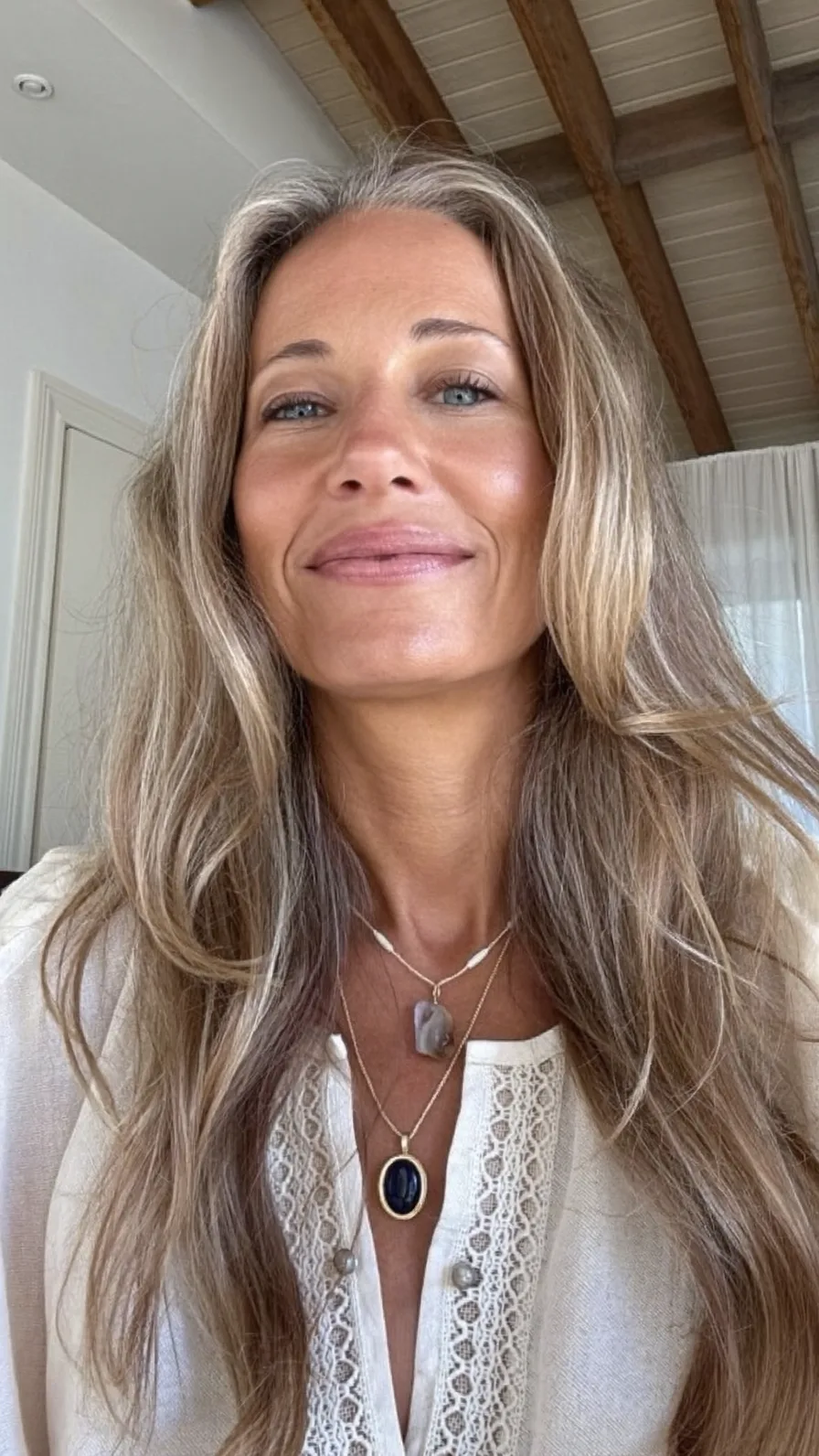 Elegant Long Layers with Subtle Ash Blonde Highlights