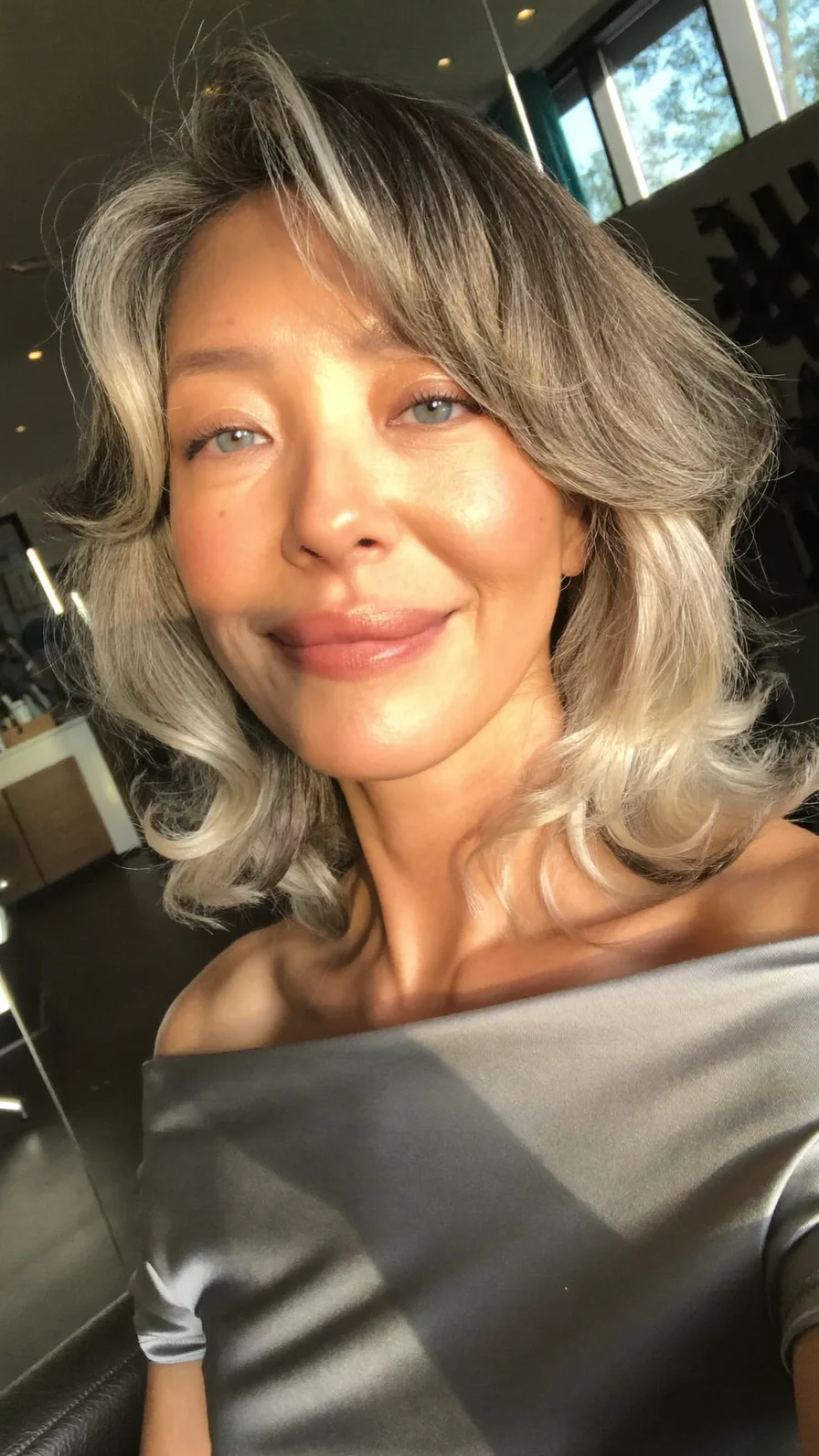 Shoulder-Length Feathered Layers with Soft Side-Swept Highlights