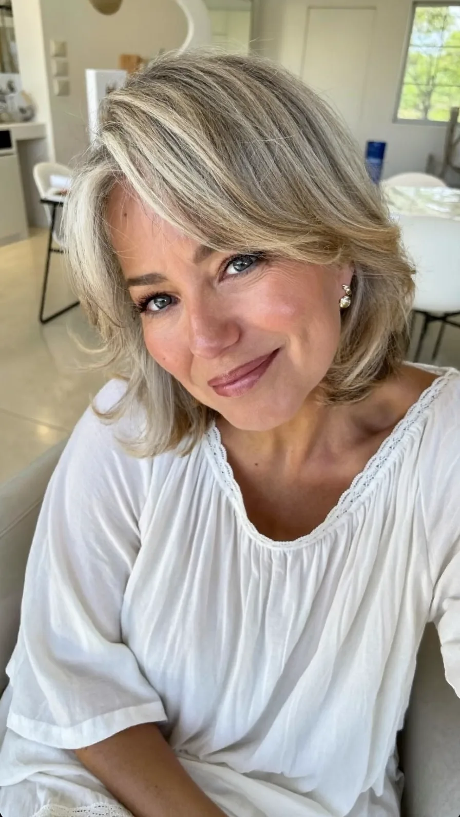 Soft Layered Shoulder-Length Hair with Curtain Bangs