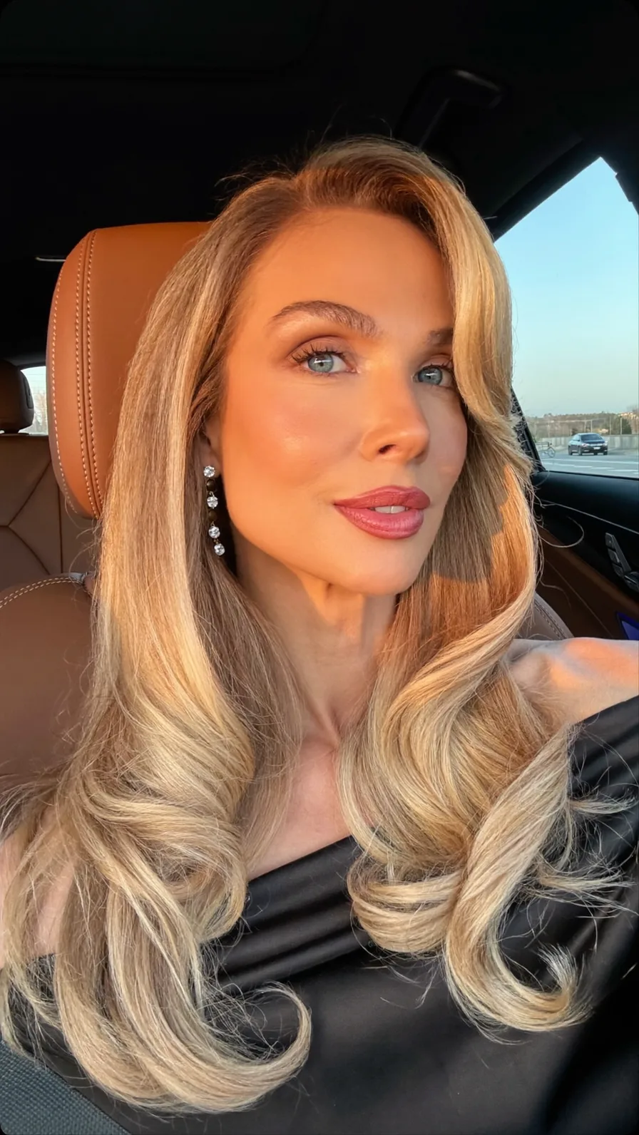 Elegant Long Layered Hair with Voluminous Side-Swept Layers