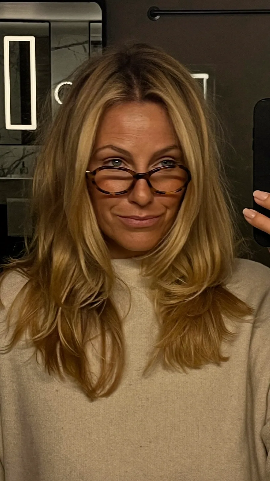 Flowing Medium-Length Honey Blonde Hair with Feathered Layers